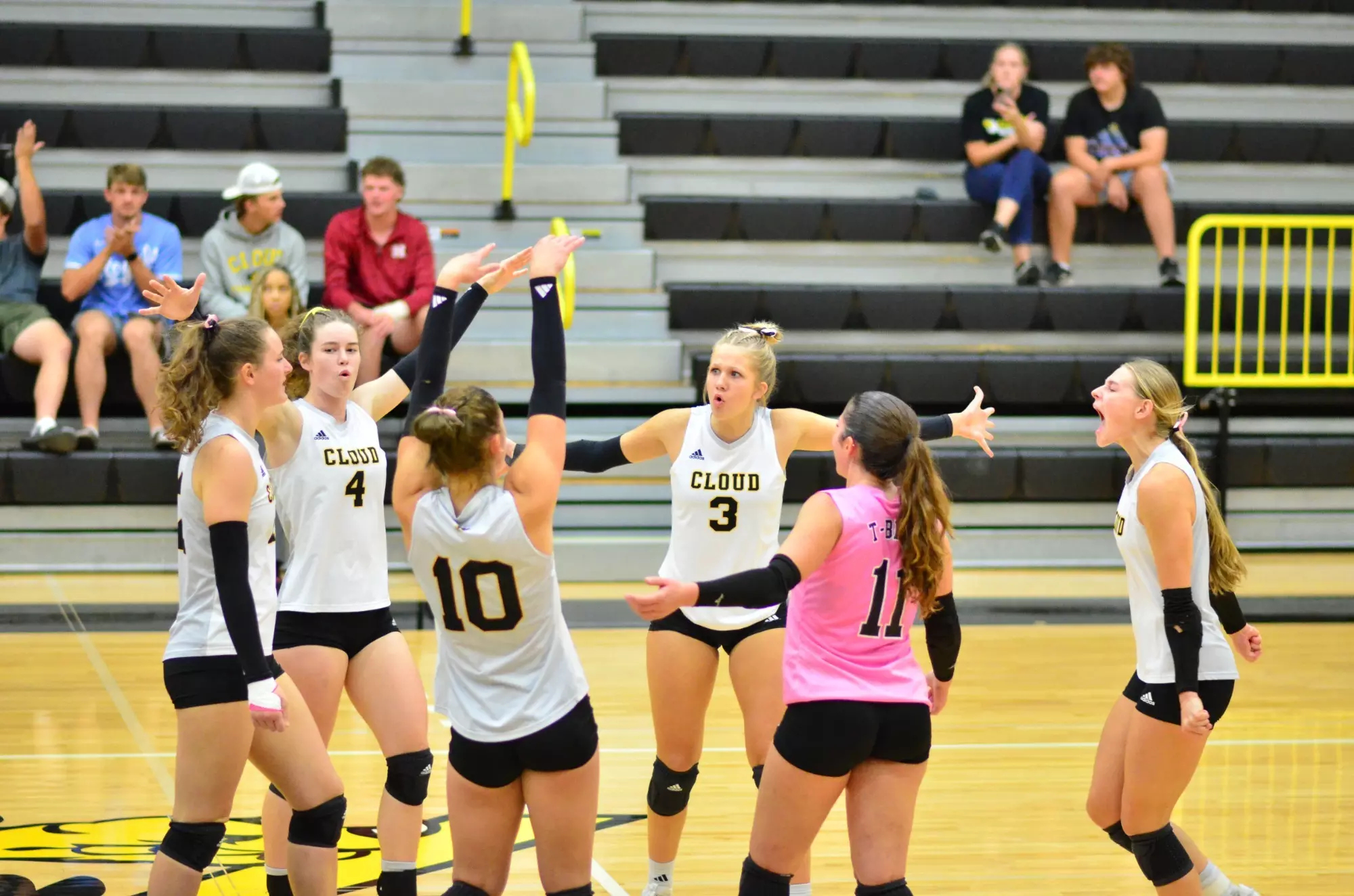 The Cloud County Volleyball team celebrates a point vs Seward County