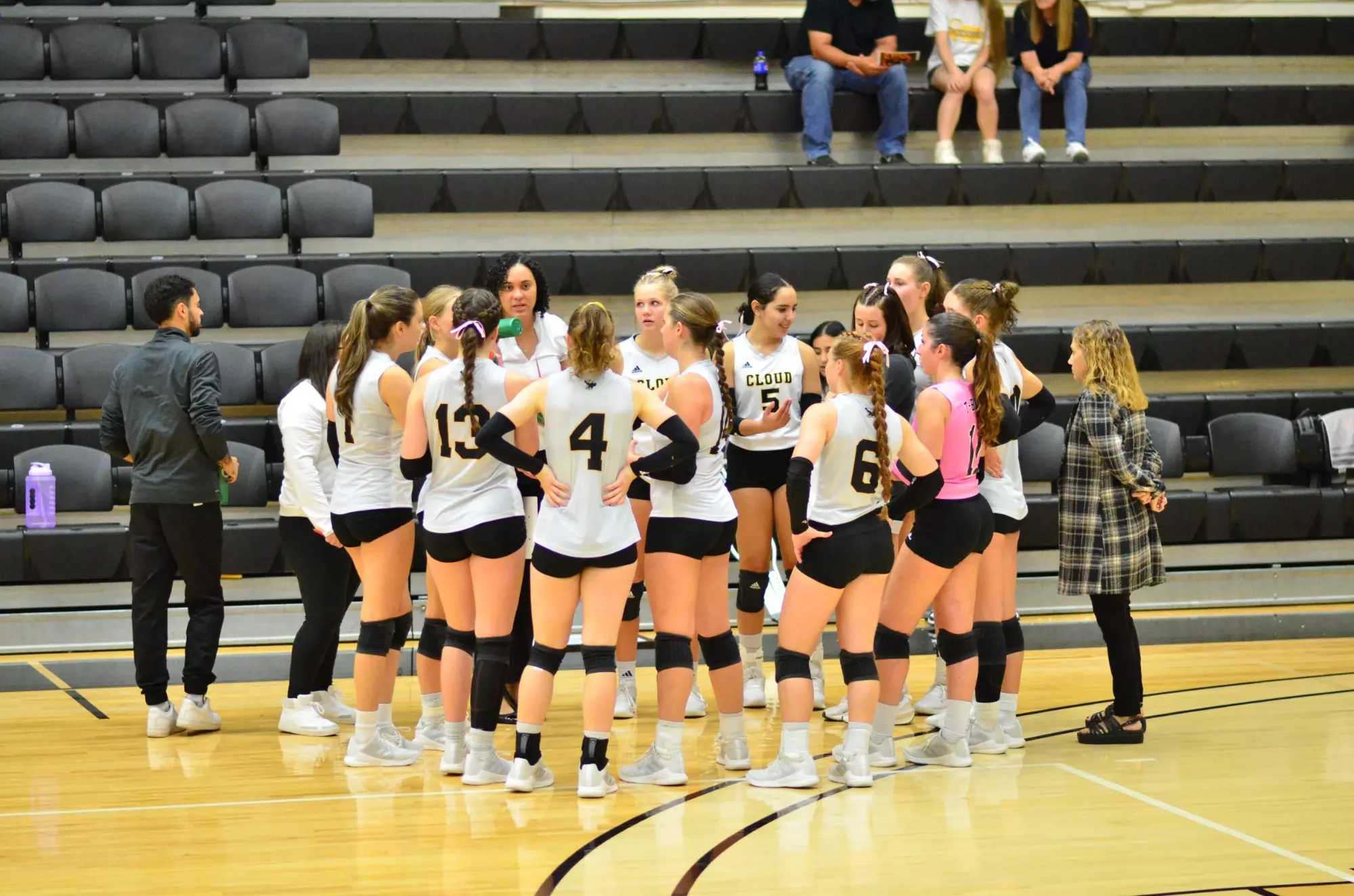 Cloud County volleyball team during timeout vs Seward County