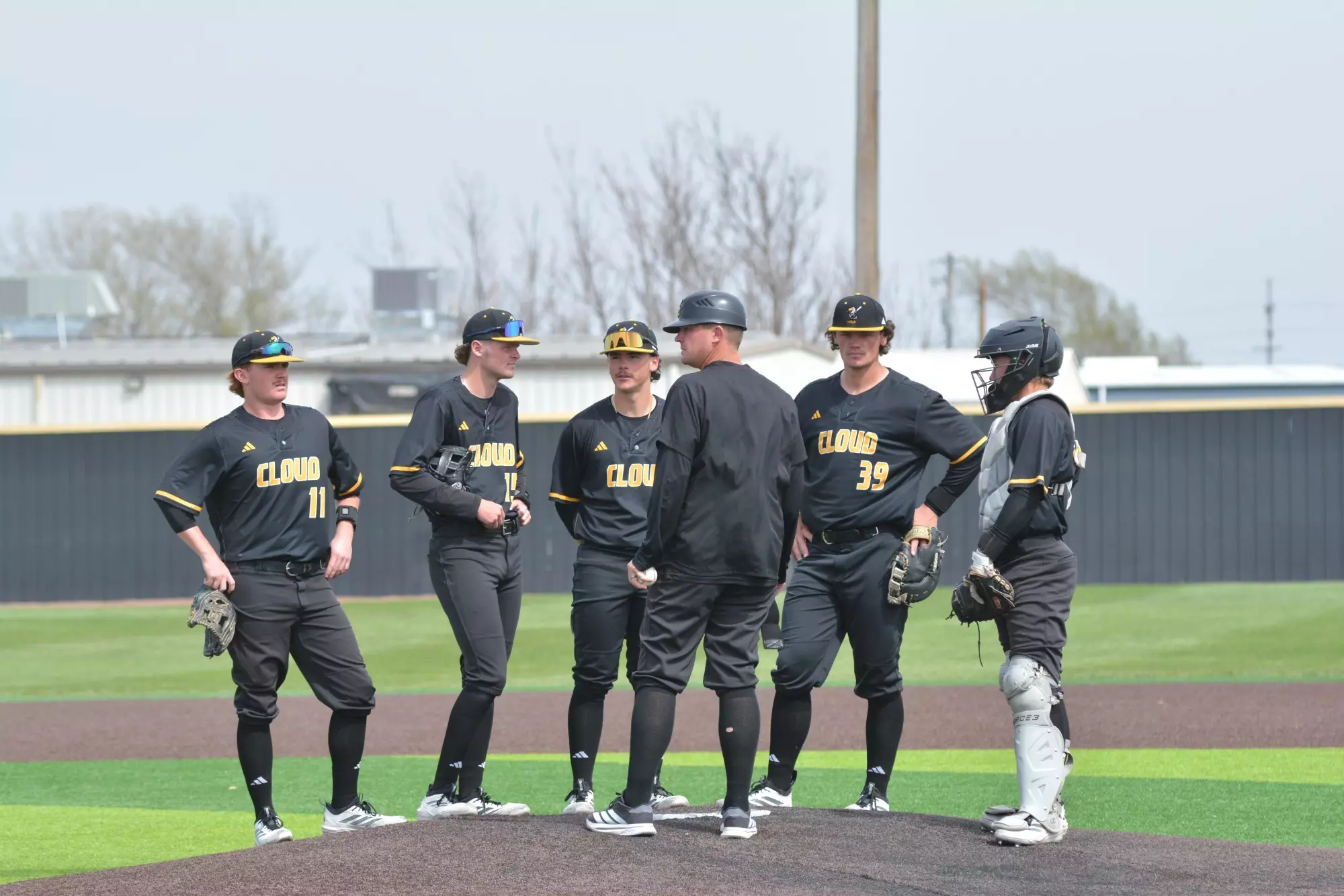Coach Eric Gilliland and the T-Bird Baseball Infielders