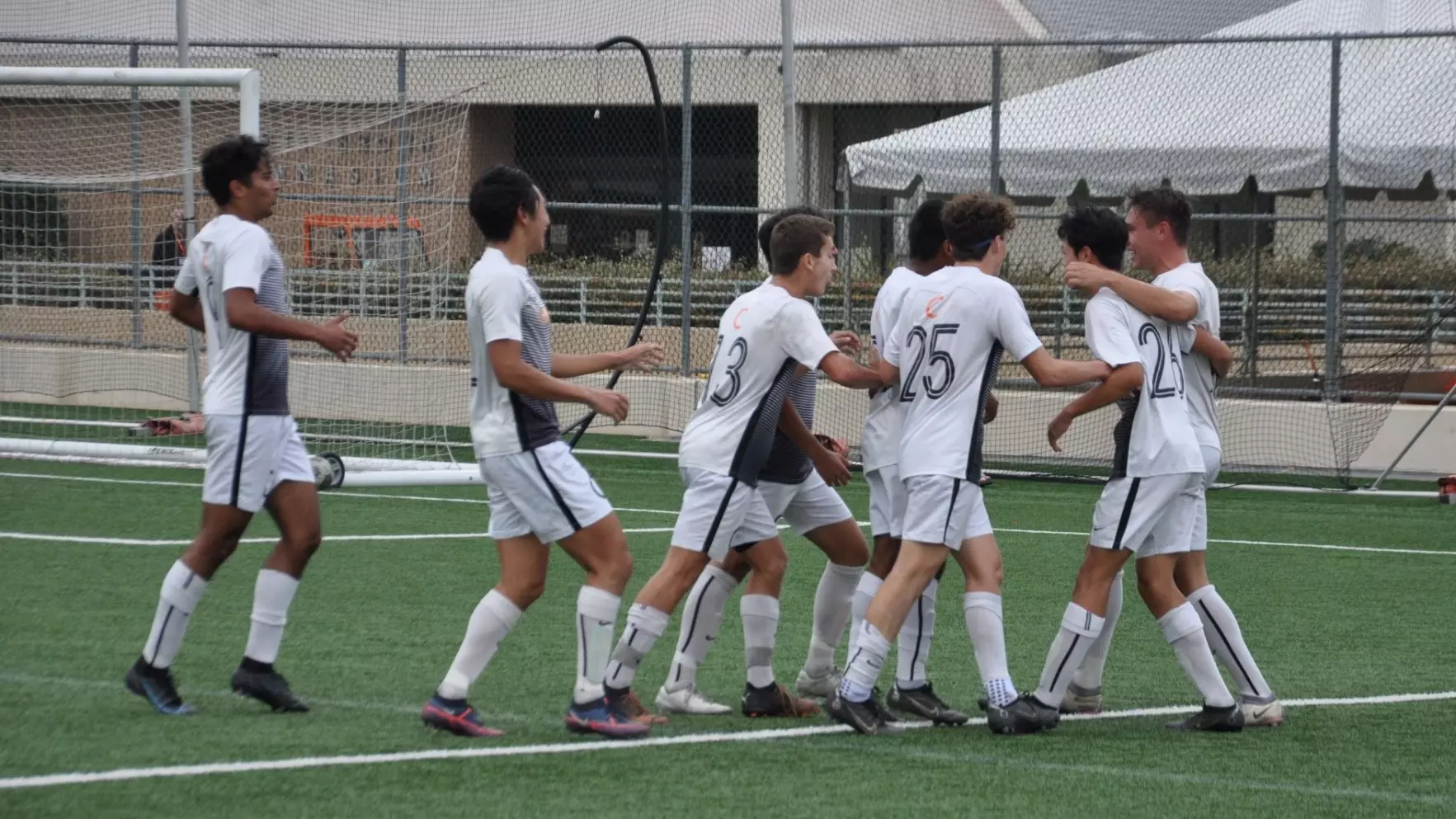 Men's Soccer celebrates a goal