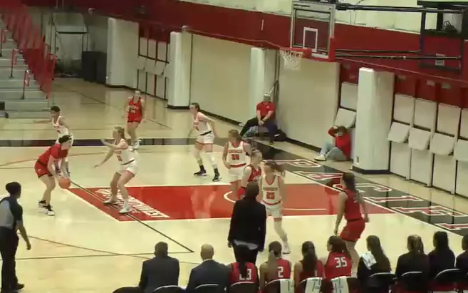 Caltech Women's Basketball players defend against Pacific University's offense