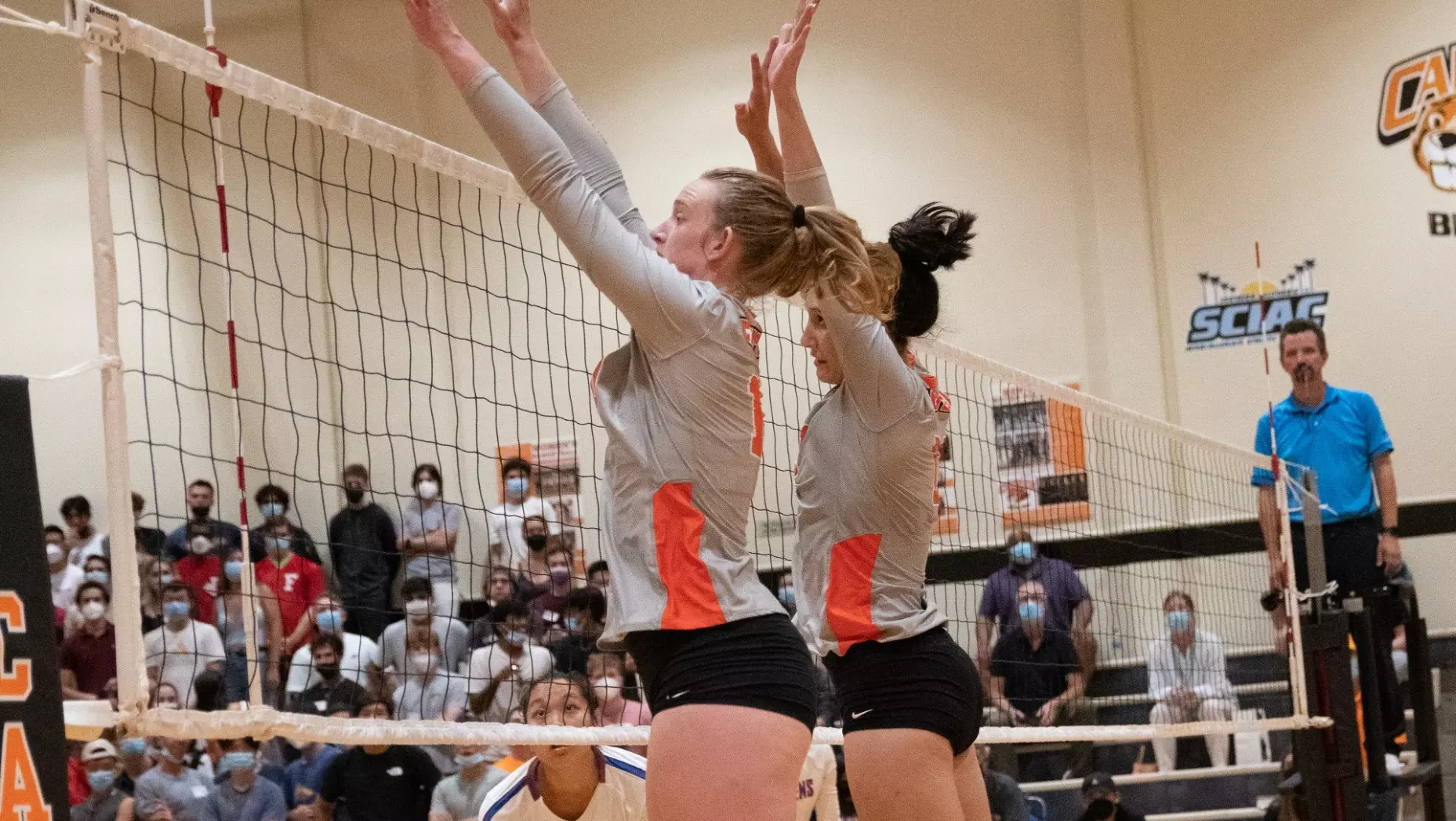 Claire Perhach and Dallas Taylor jump up for a block attempt