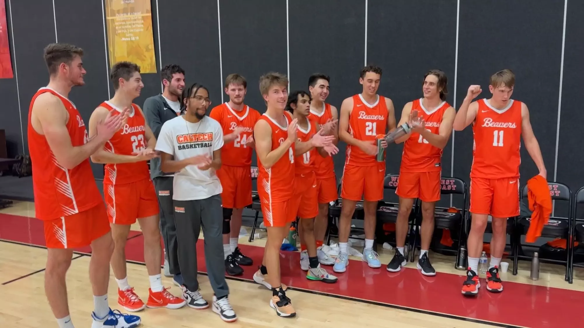 Men's Basketball players celebrate their win over West Coast Baptist College