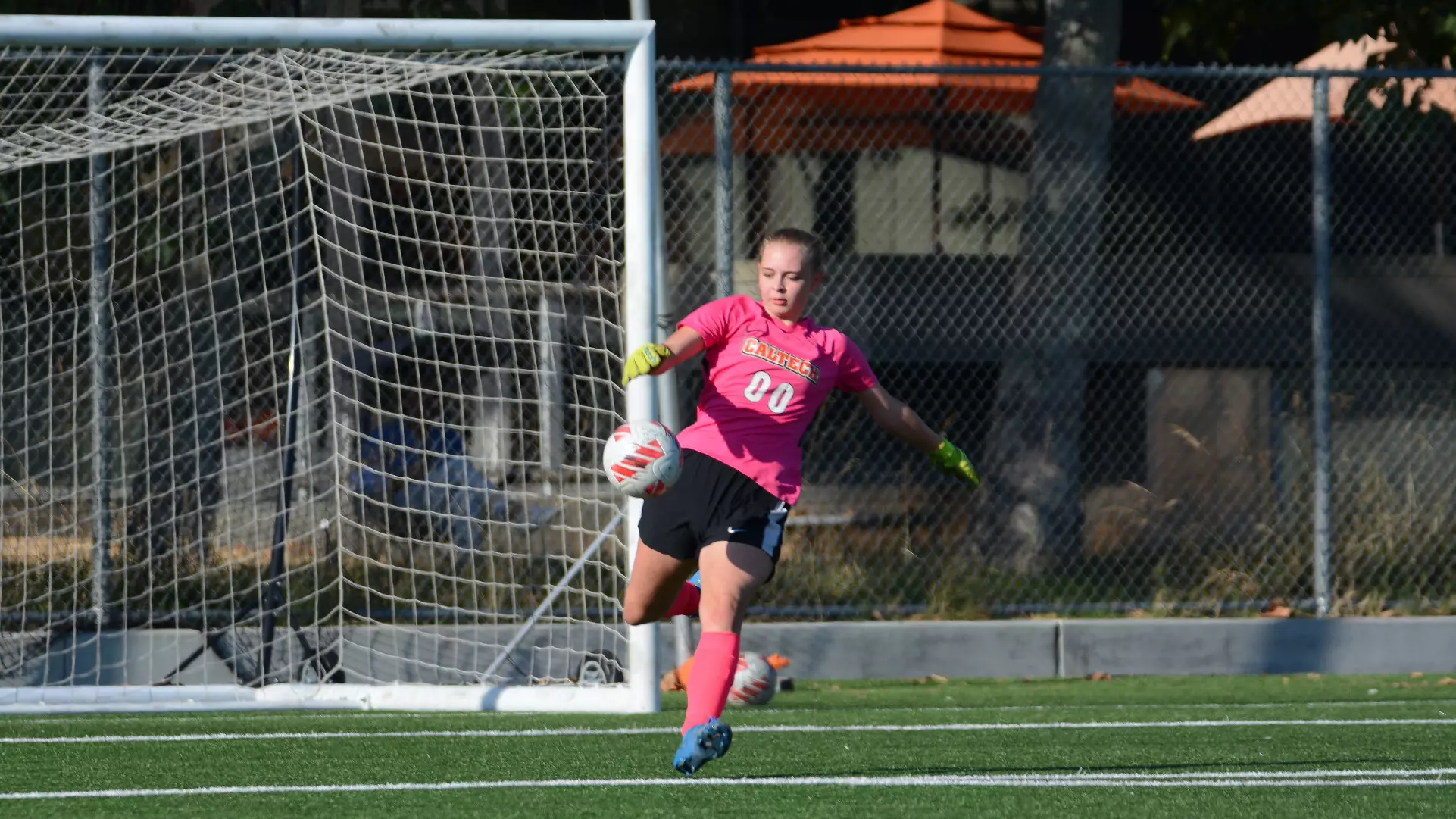 Haleigh Gardner drop-kicking the ball upfield