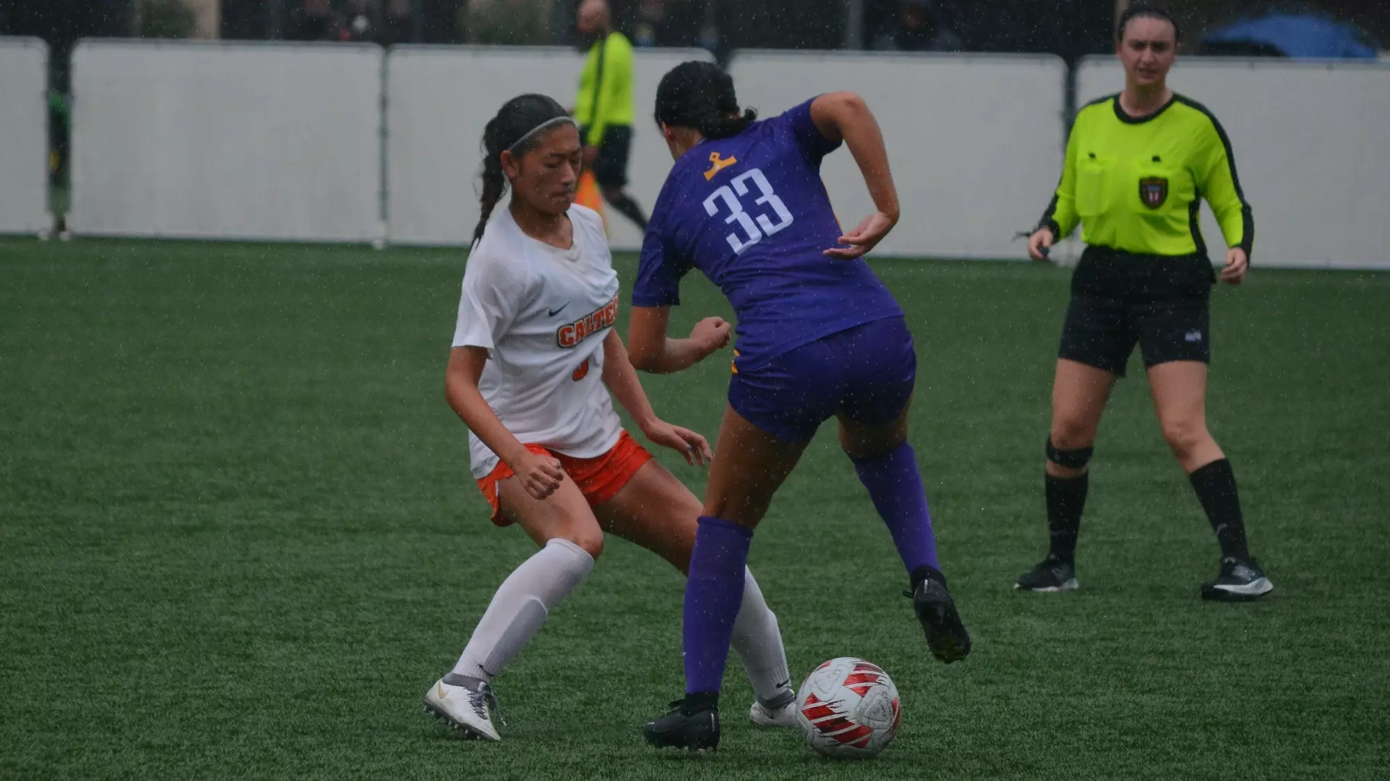 Ellie Yamada battles for the ball against a Cal Lutheran defender
