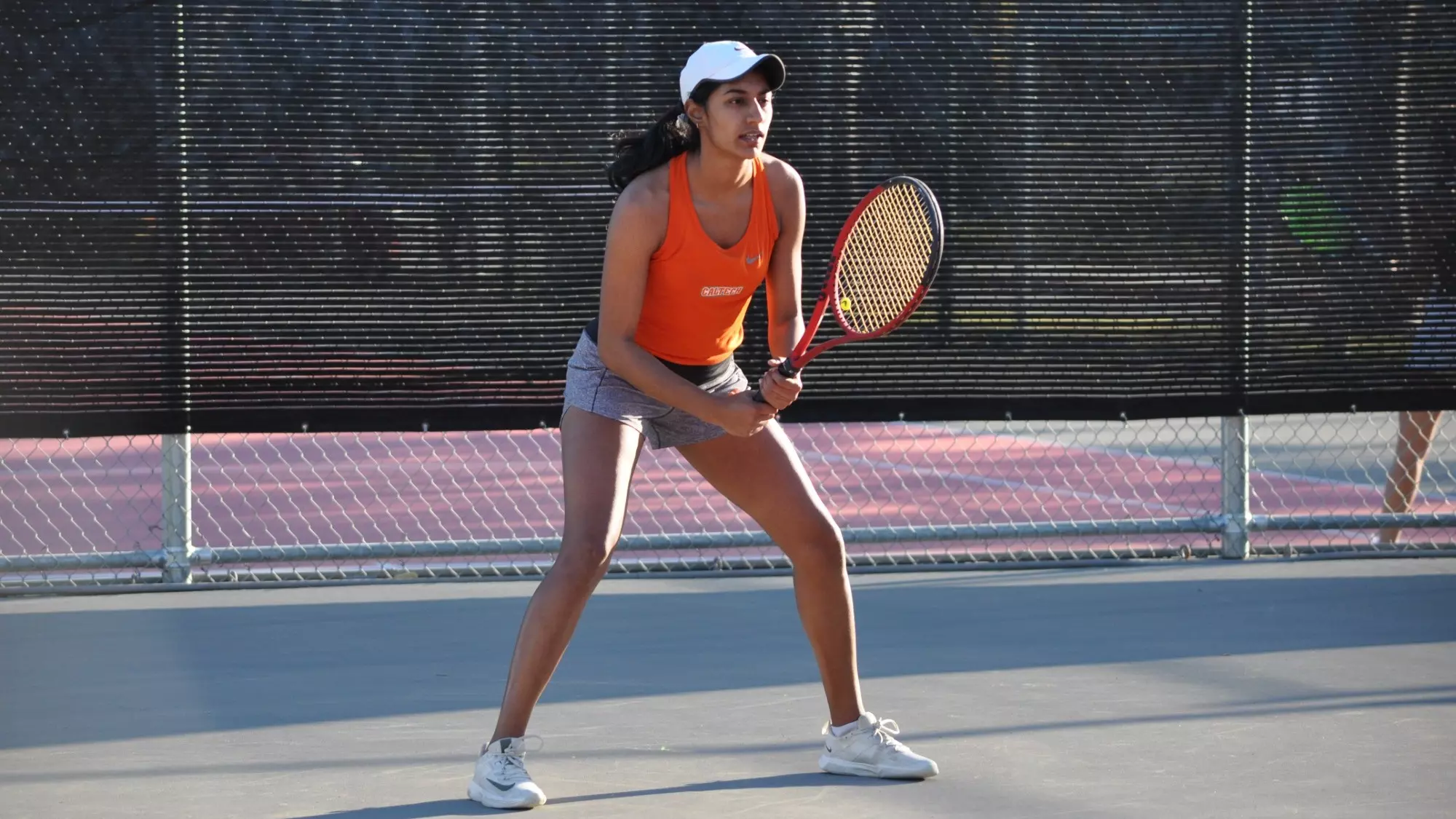 Anika Arora awaits a serve in singles play