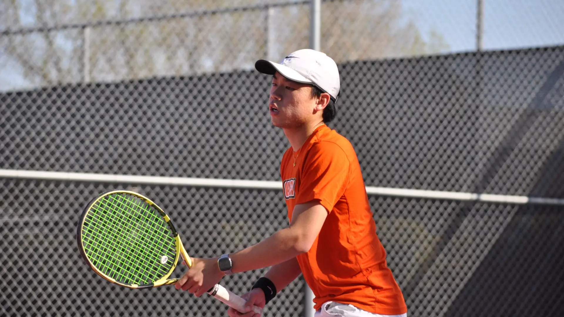 Daniel Wen prepares to serve