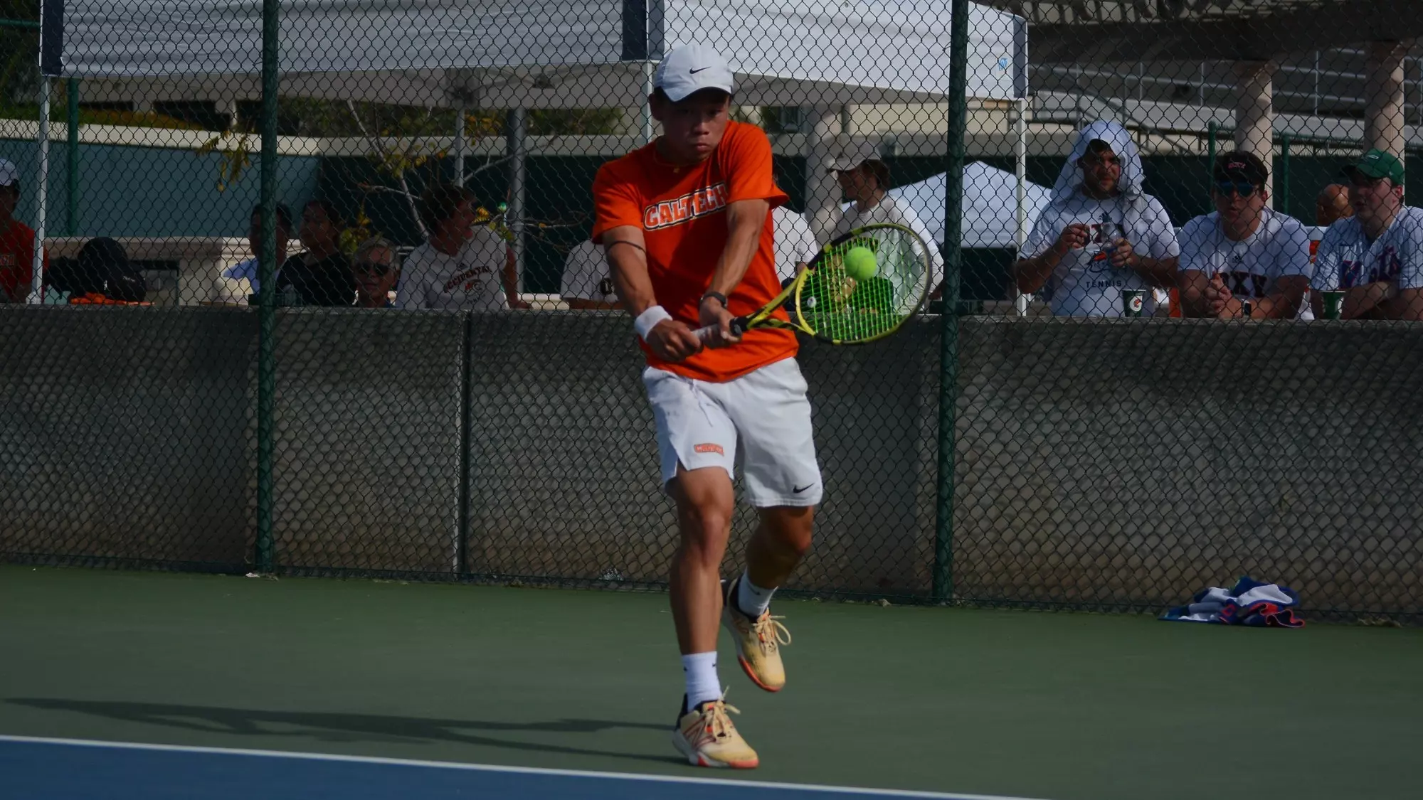 Daniel Wen returns a ball with his backhand