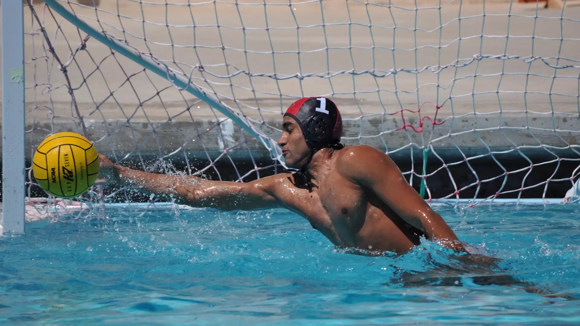 Sujit Iyer reaches to his right to make a save