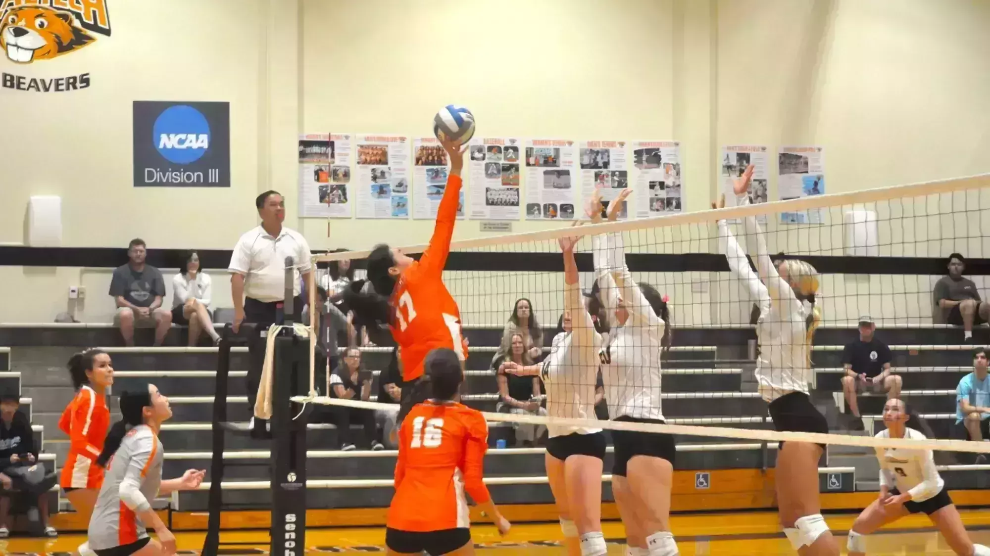 Andrea Li towering over Whittier defenders and hitting ball