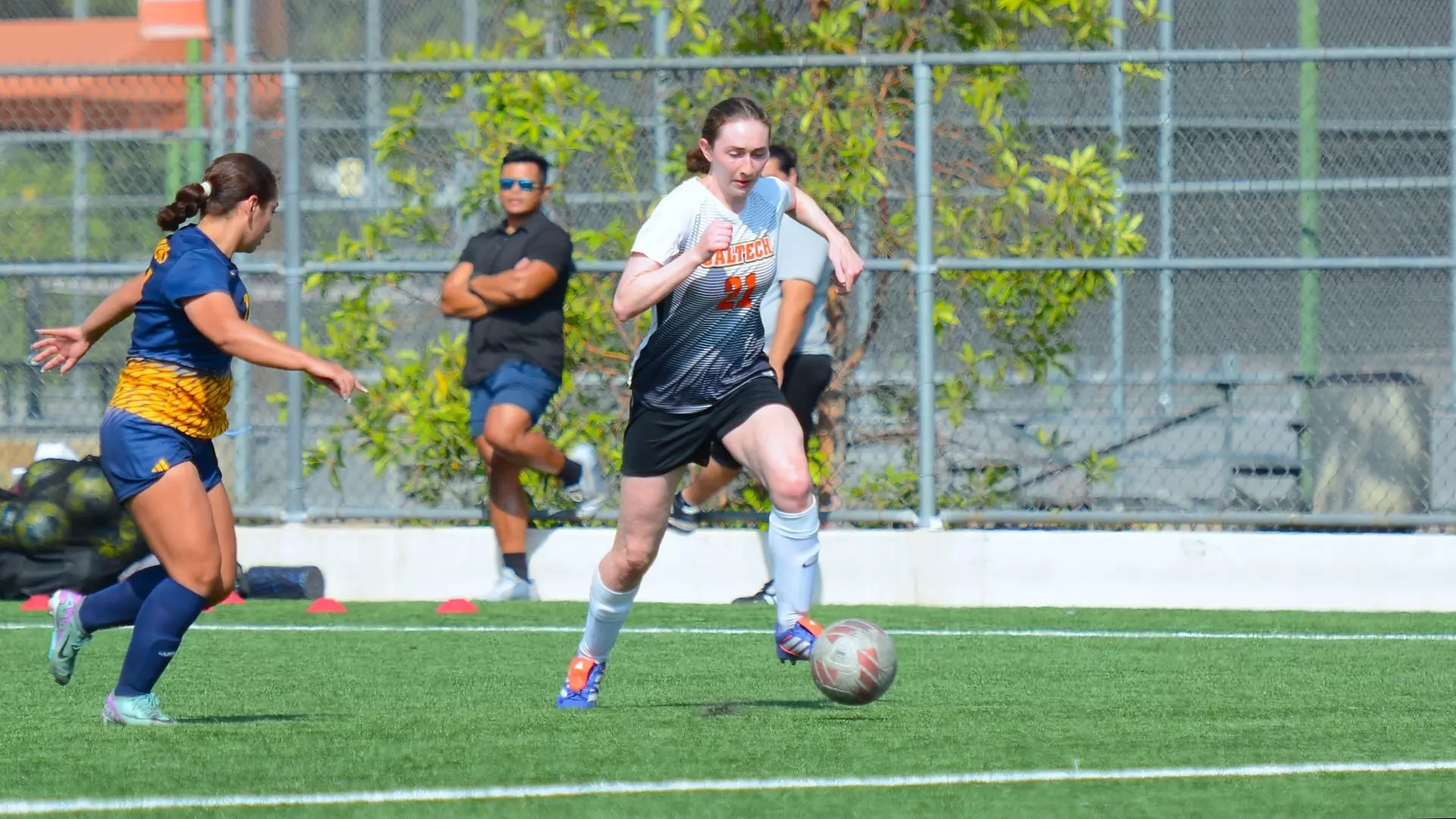 Jennifer Solgaard of Caltech women's soccer dribbling the ball in a 2024 game at North Field