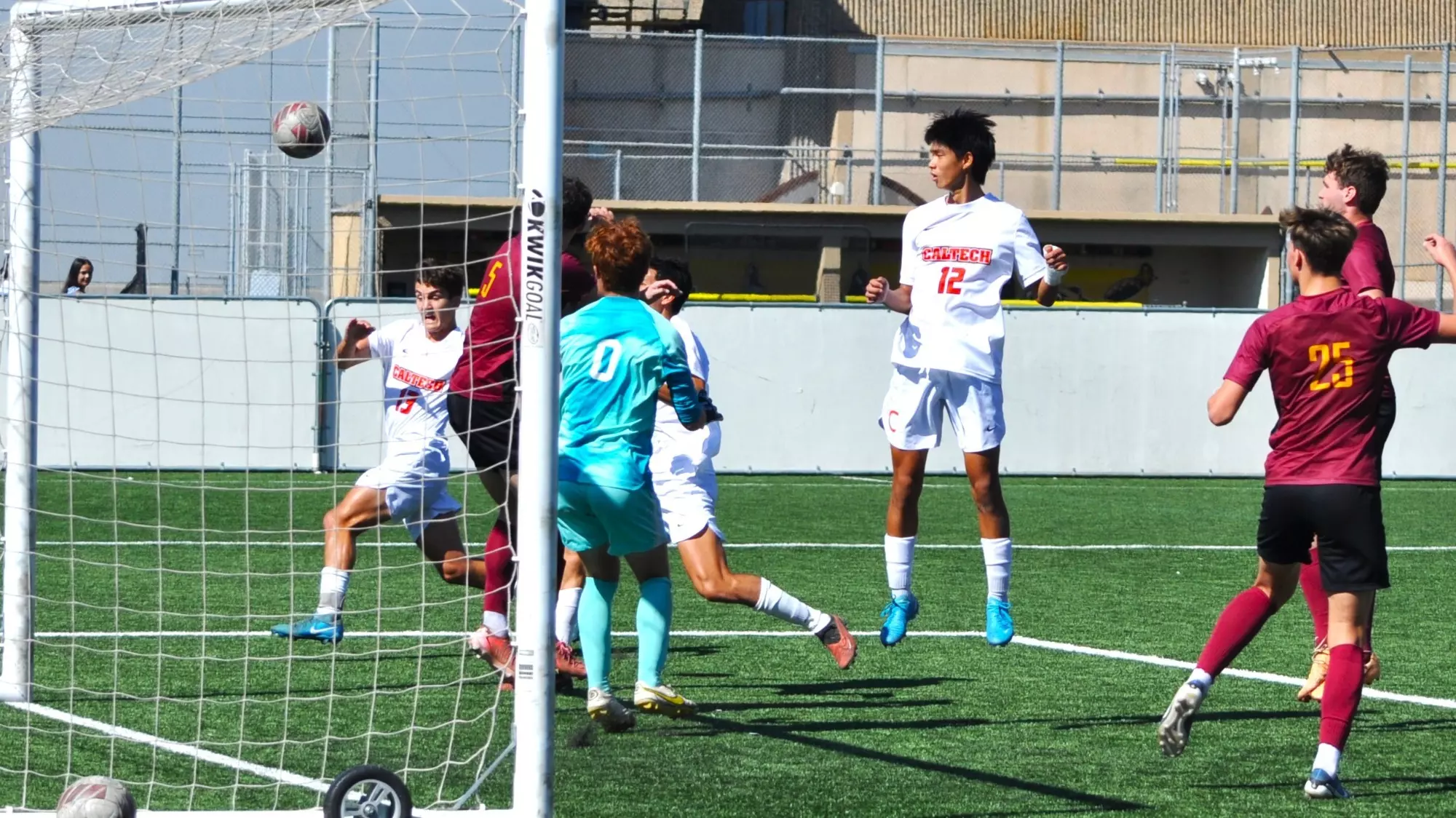 Matthew Luk and Andy Dimnaku of Men's Soccer in front of net action shot vs. CMS