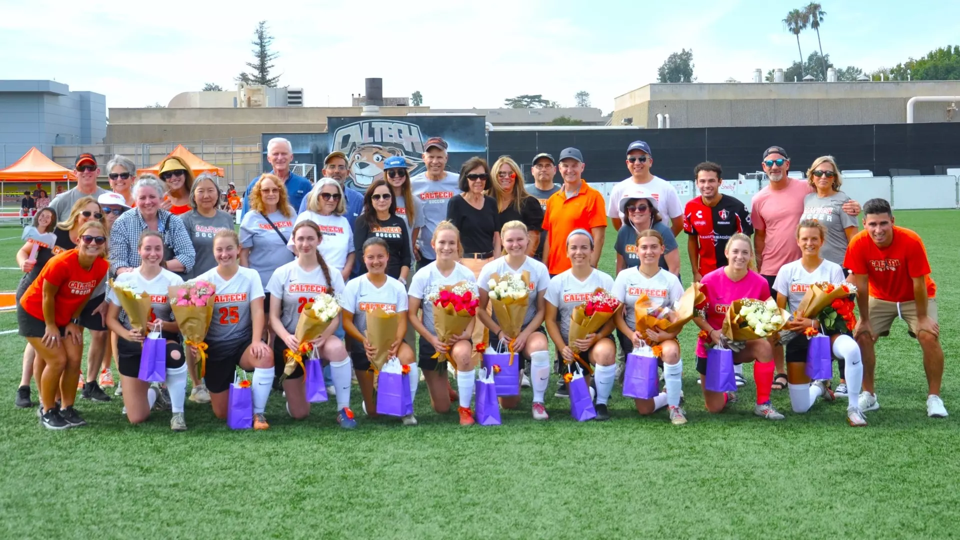 Photo of Caltech Women's Soccer 2024 seniors along with their families, friends and team coaches