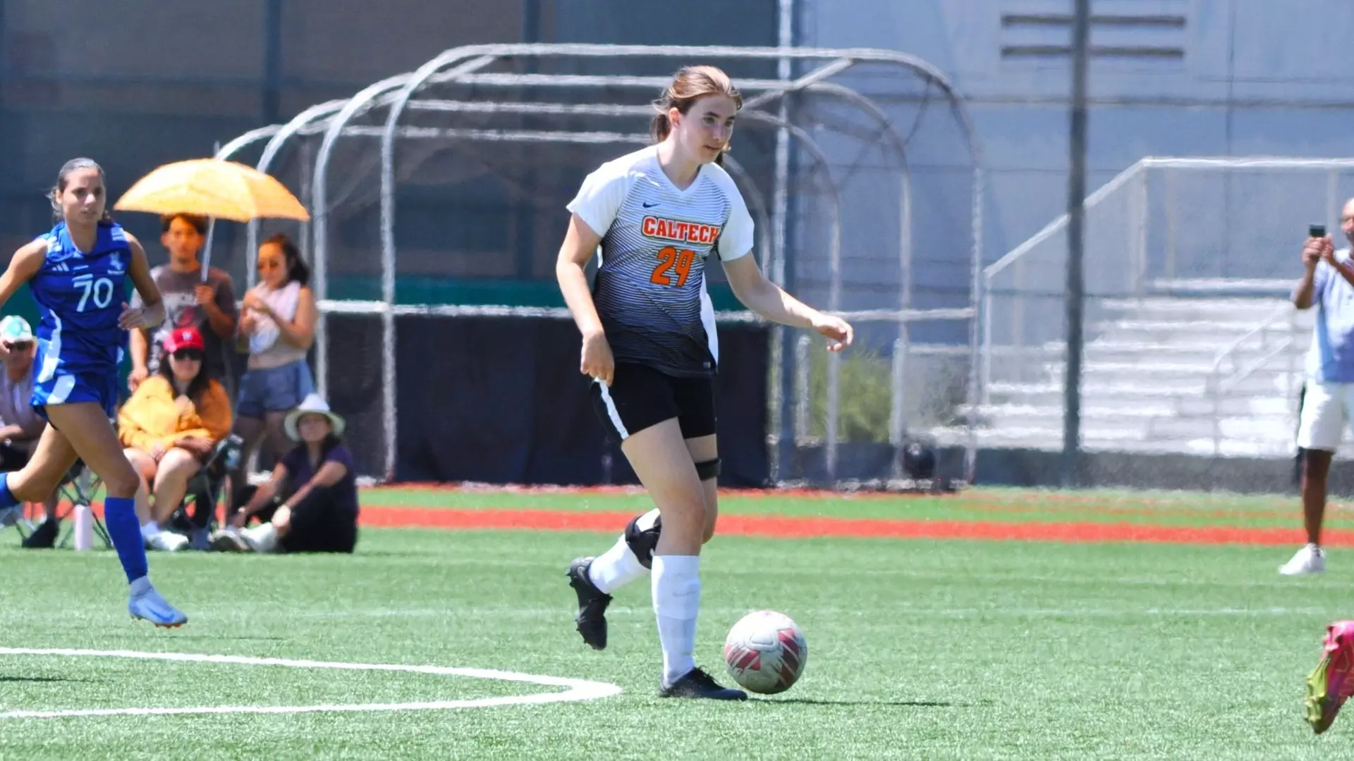 Women's soccer Alexa Baxter dribbles the ball during Caltech's August game against Stanton University