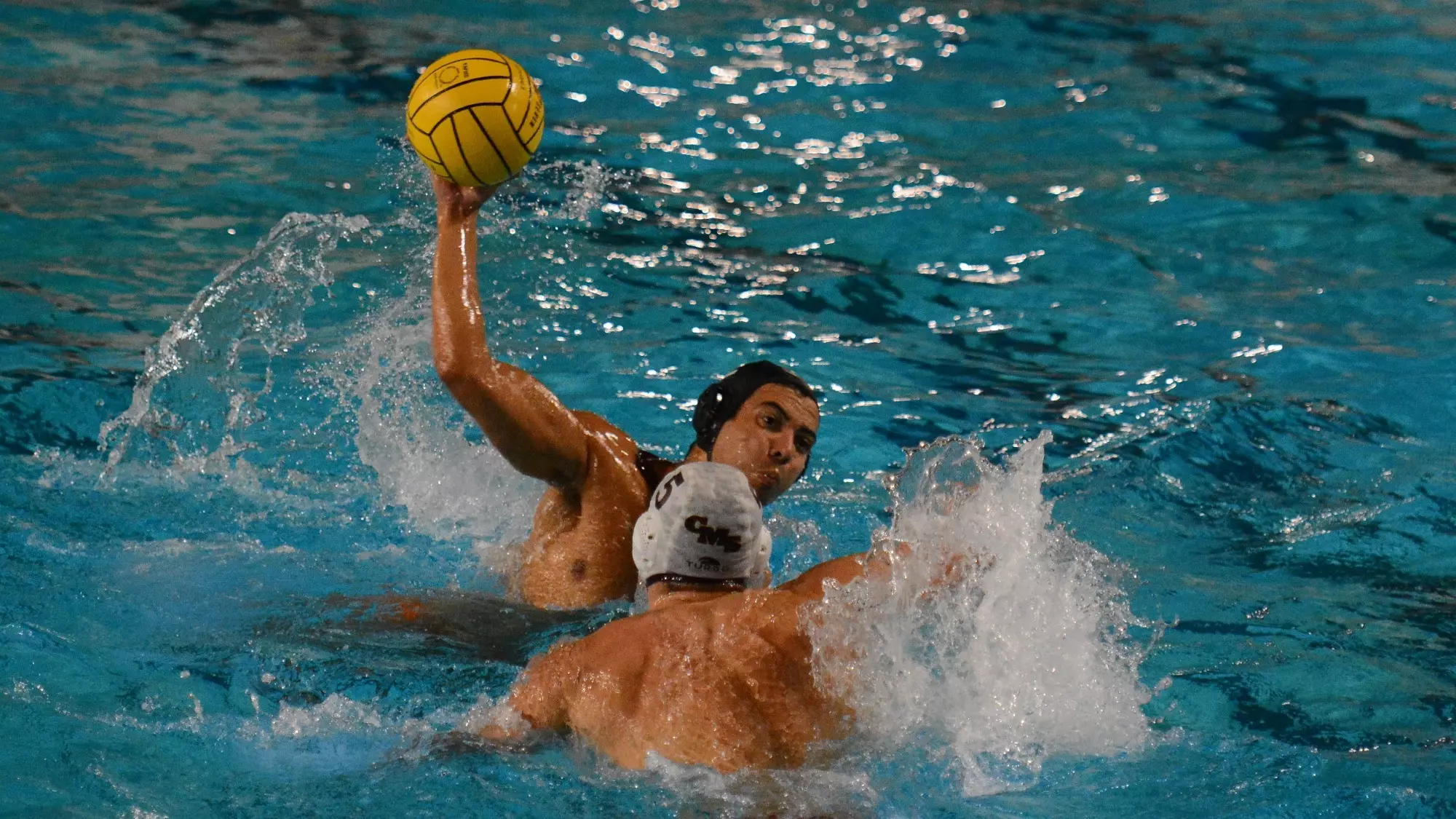 Andres Heredia takes a shot while a CMS defender guards him