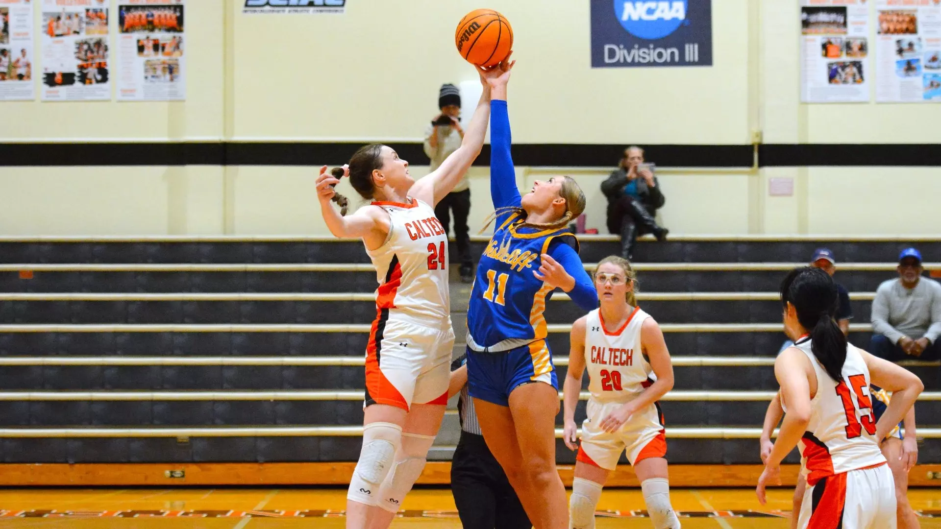 Photo of the opening tipoff between Caltech Women's Basketball's Kathryn Edwards and Westcliff's starting center during a 12-10-2024 home game