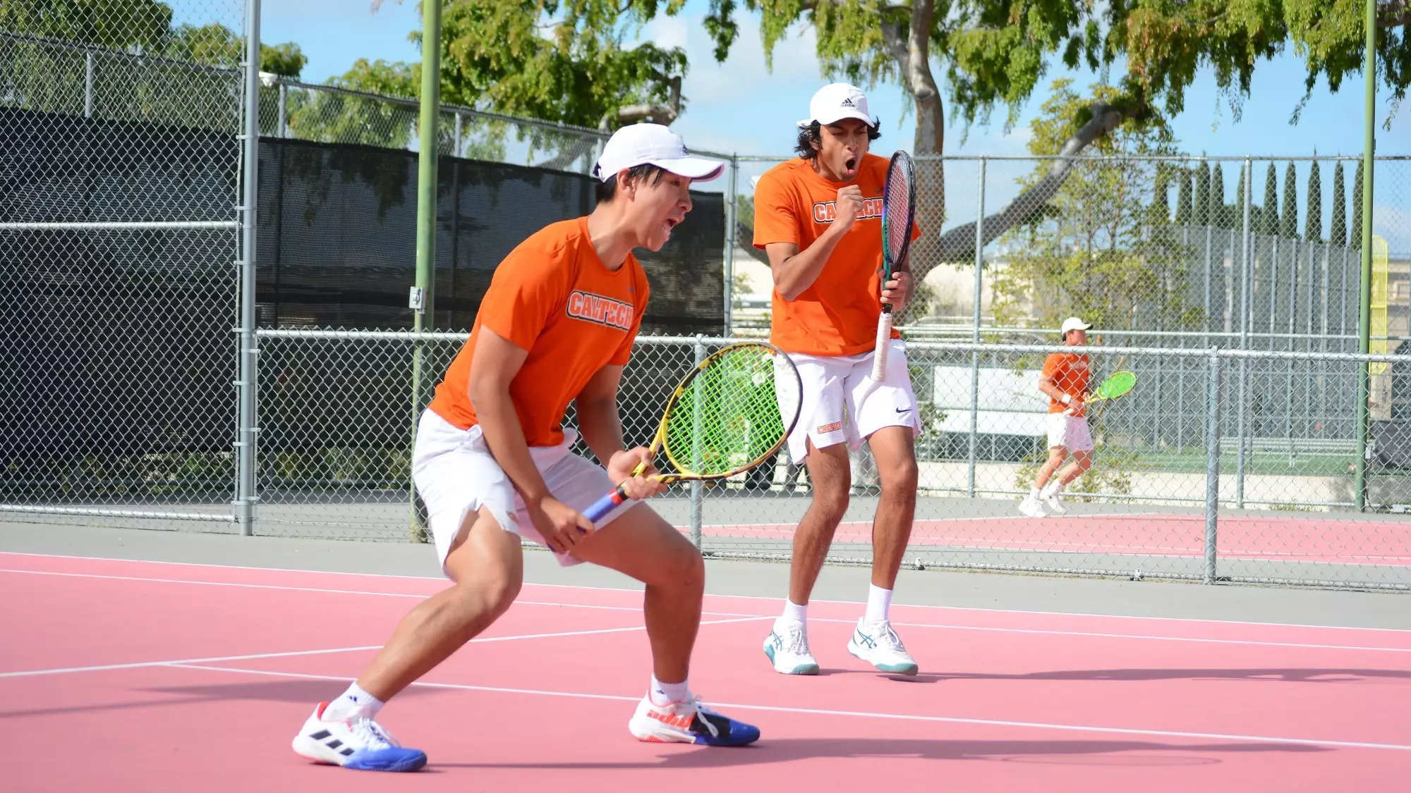 Eric He and Aditya Srinivasan celebrate a point in doubles