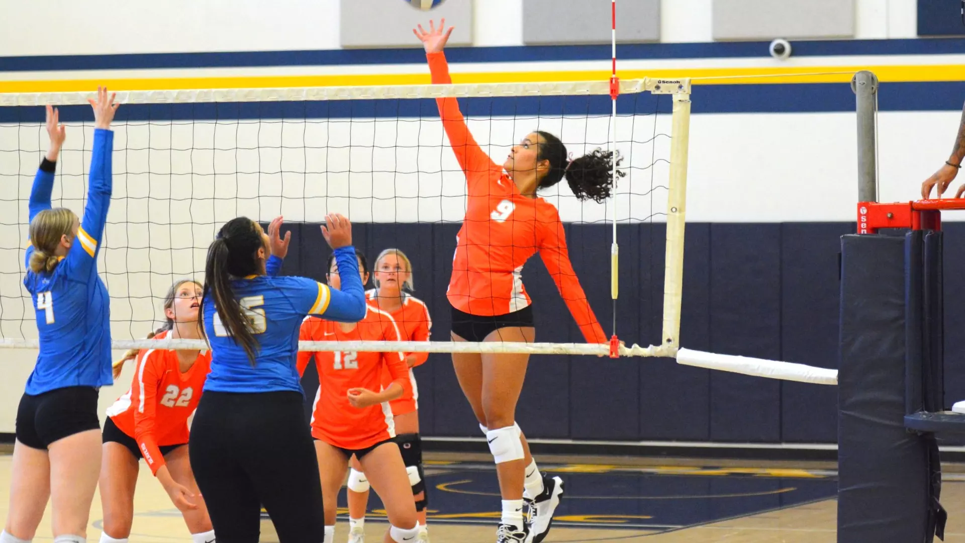 Caltech Volleyball's Brittany Rosario spiking the ball over the net in their match against Westcliff