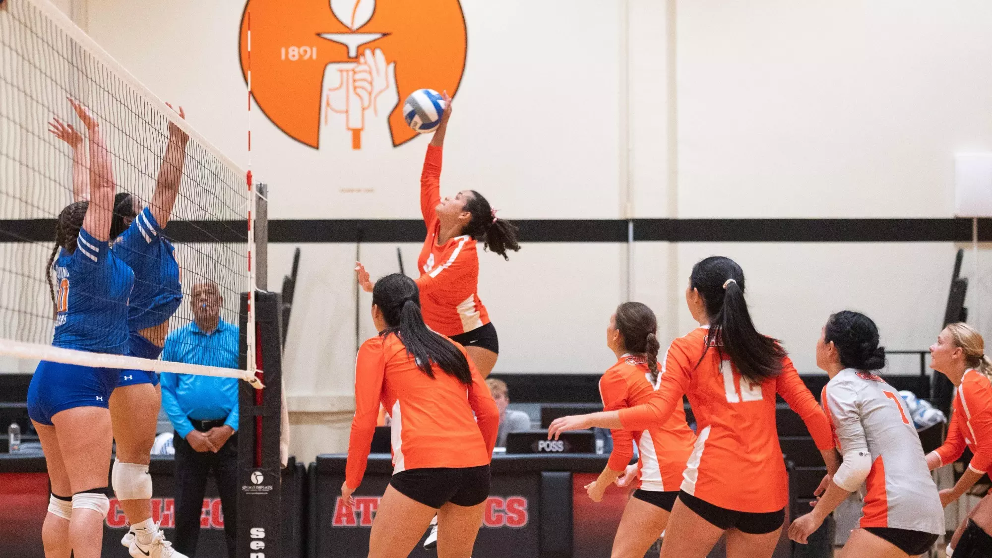 Brittany Rosario spikes the ball against Providence Christian