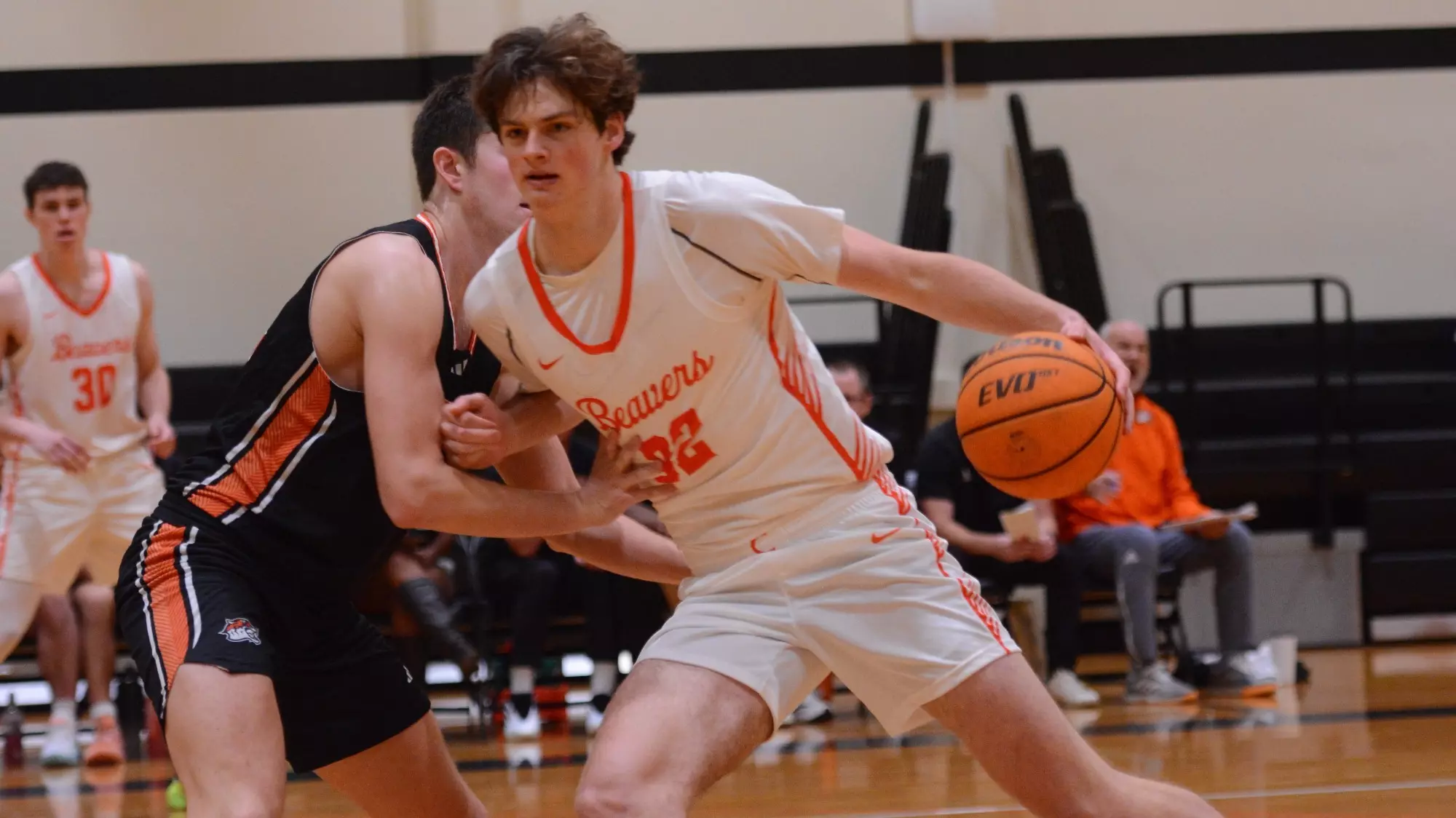 Finnegan Fancher, wearing a white jersey with 