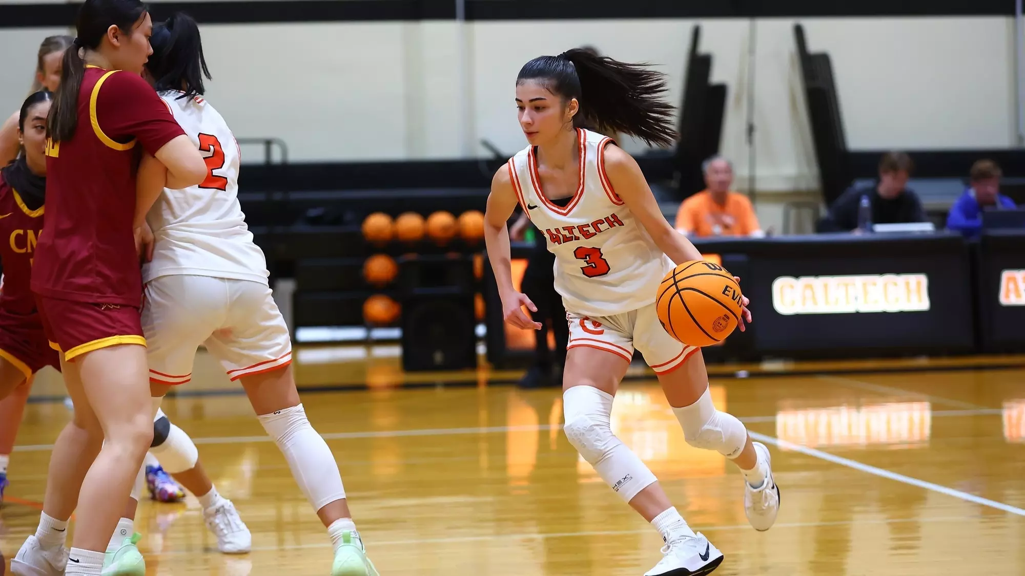 Zeynep Goktepe dribbles to her left while controlling the ball in her left hand around a screen set by her teammate against CMS. 
