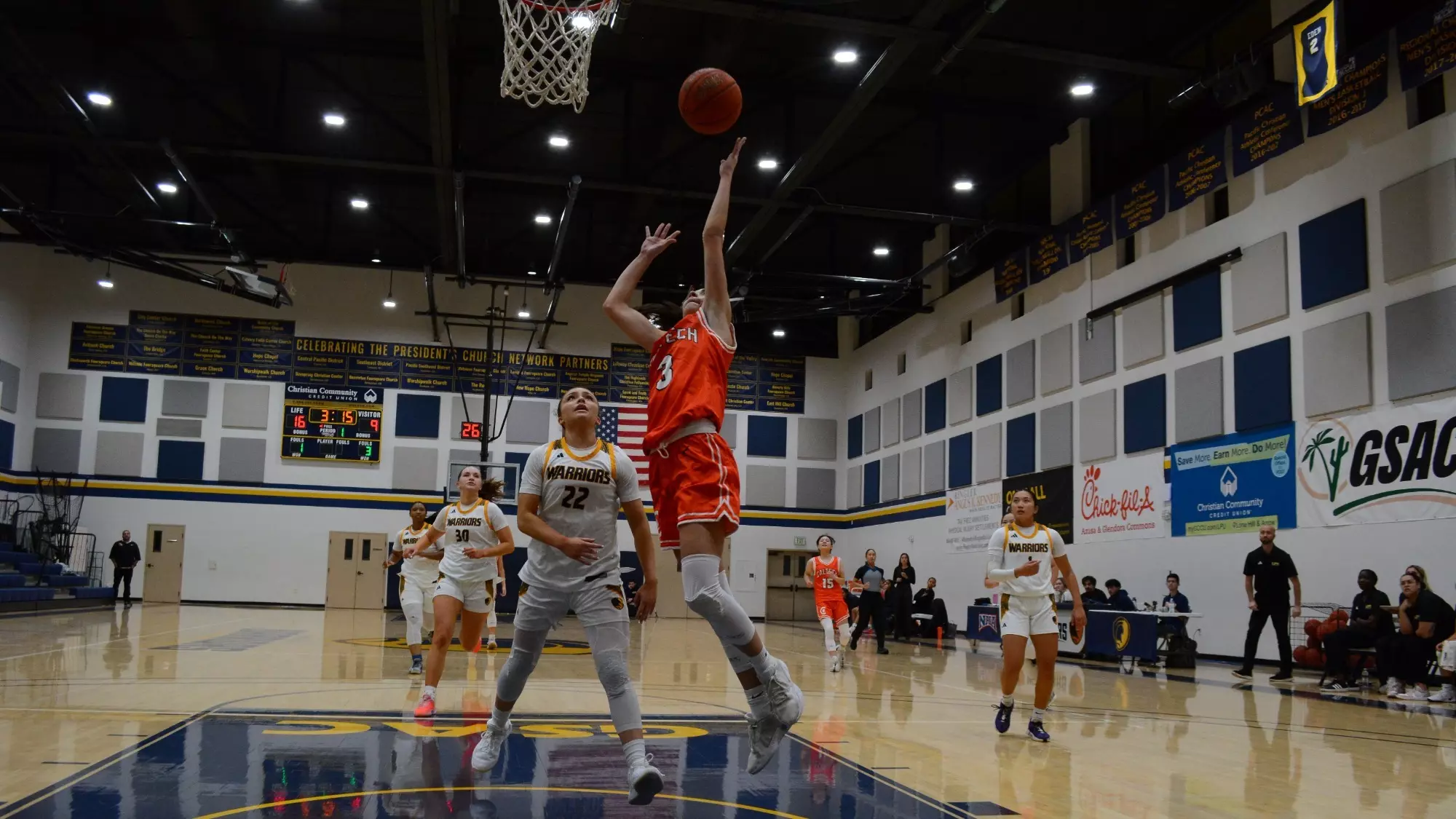 Zeynep Goktepe elevates for a left-handed layup as a defender looks up from the restricted area 