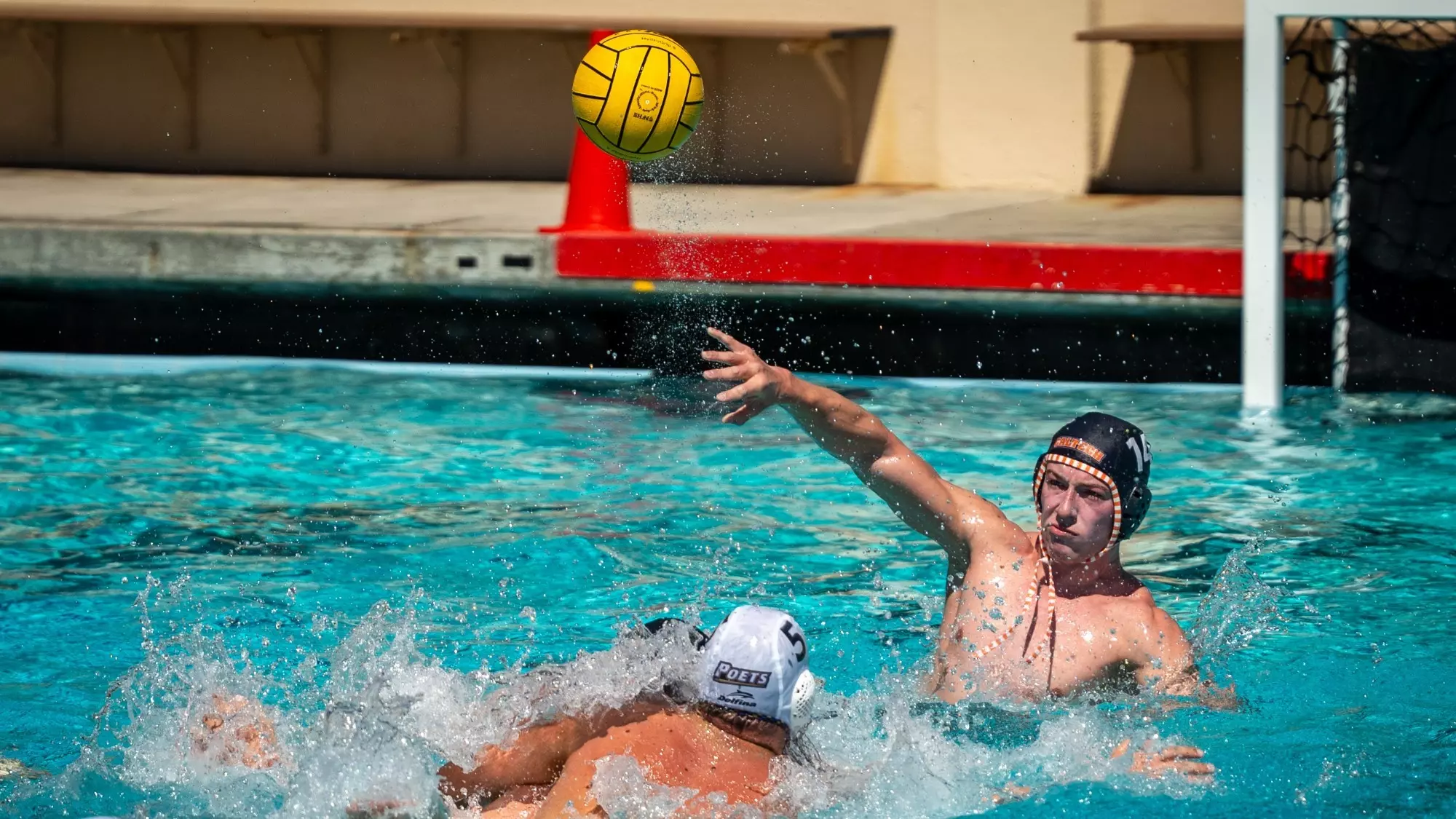 Carl Crum throws the ball up the pool against Whittier