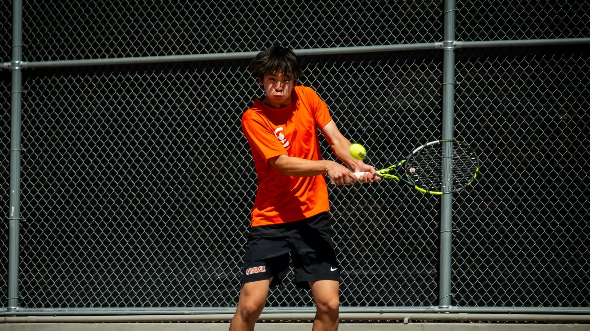 Michael Gao hits a backhand shot