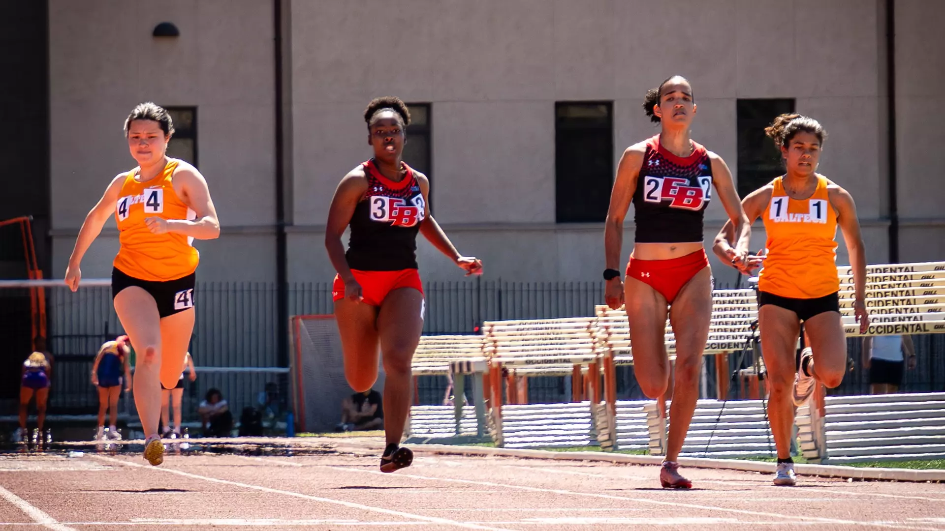 Women's track runners from Caltech and Cal State East Bay