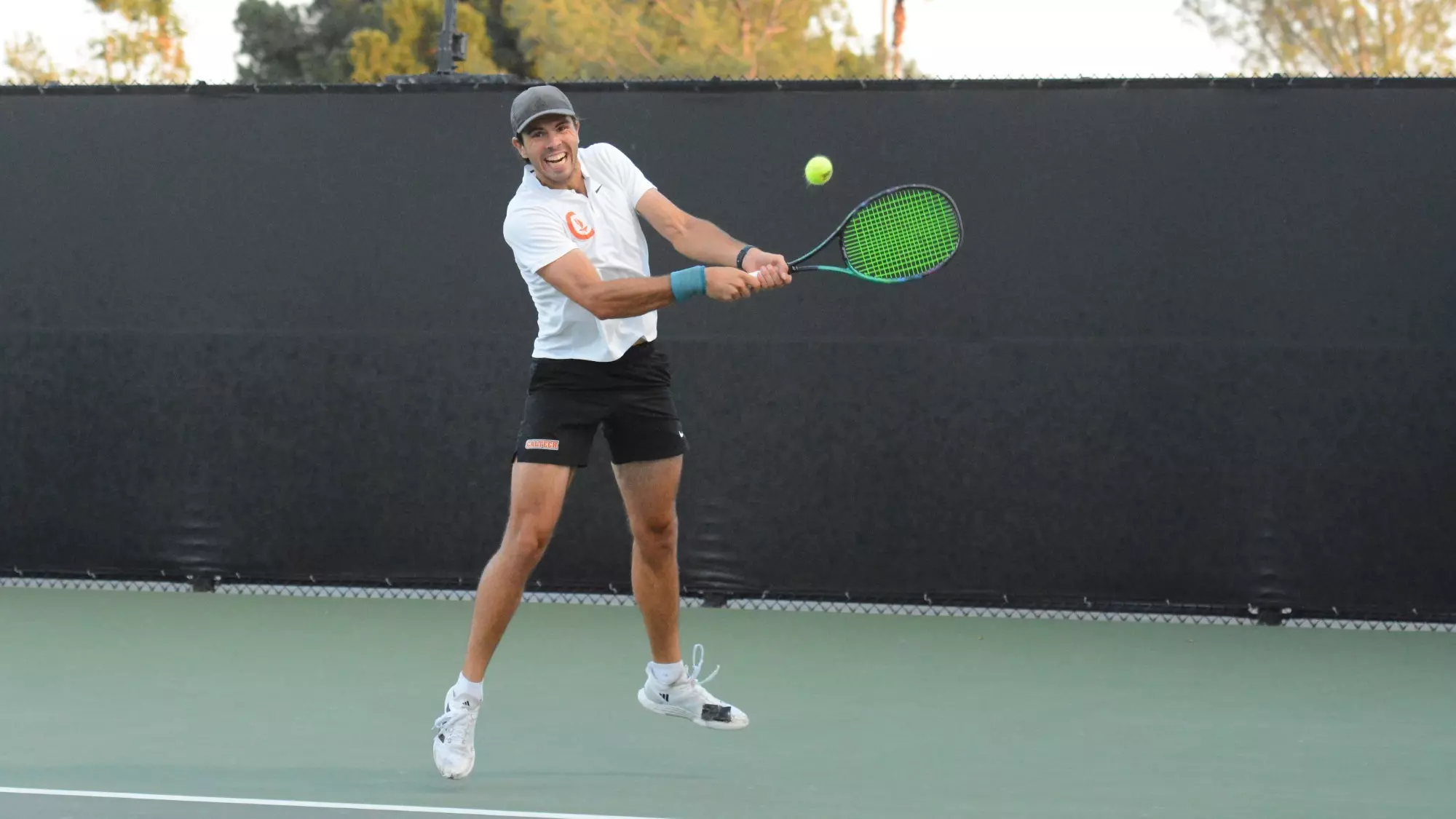 Andrew Zabelo hits a backhand shot