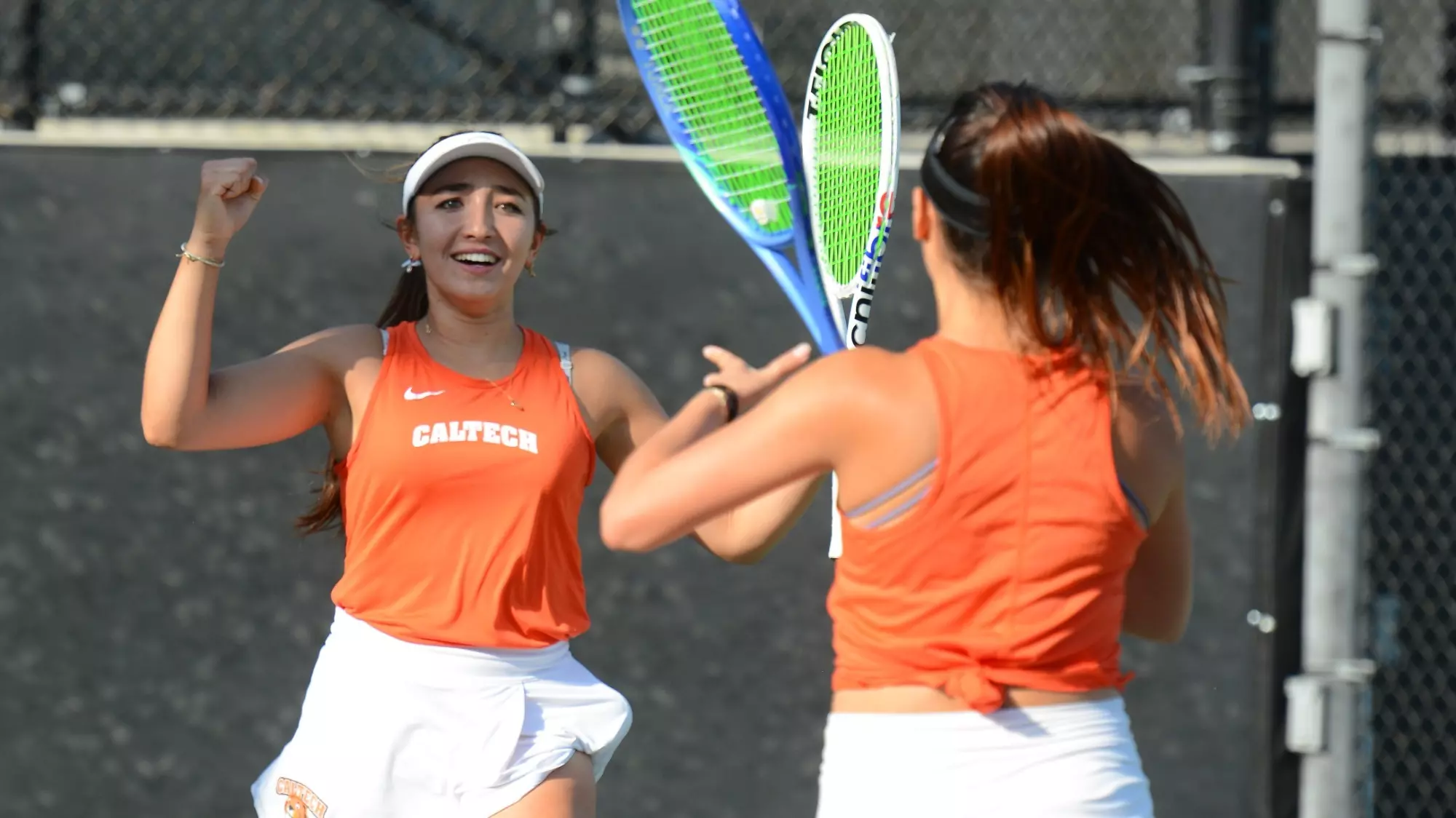Polaris Hayes celebrates winning a match with Carissa Gerung