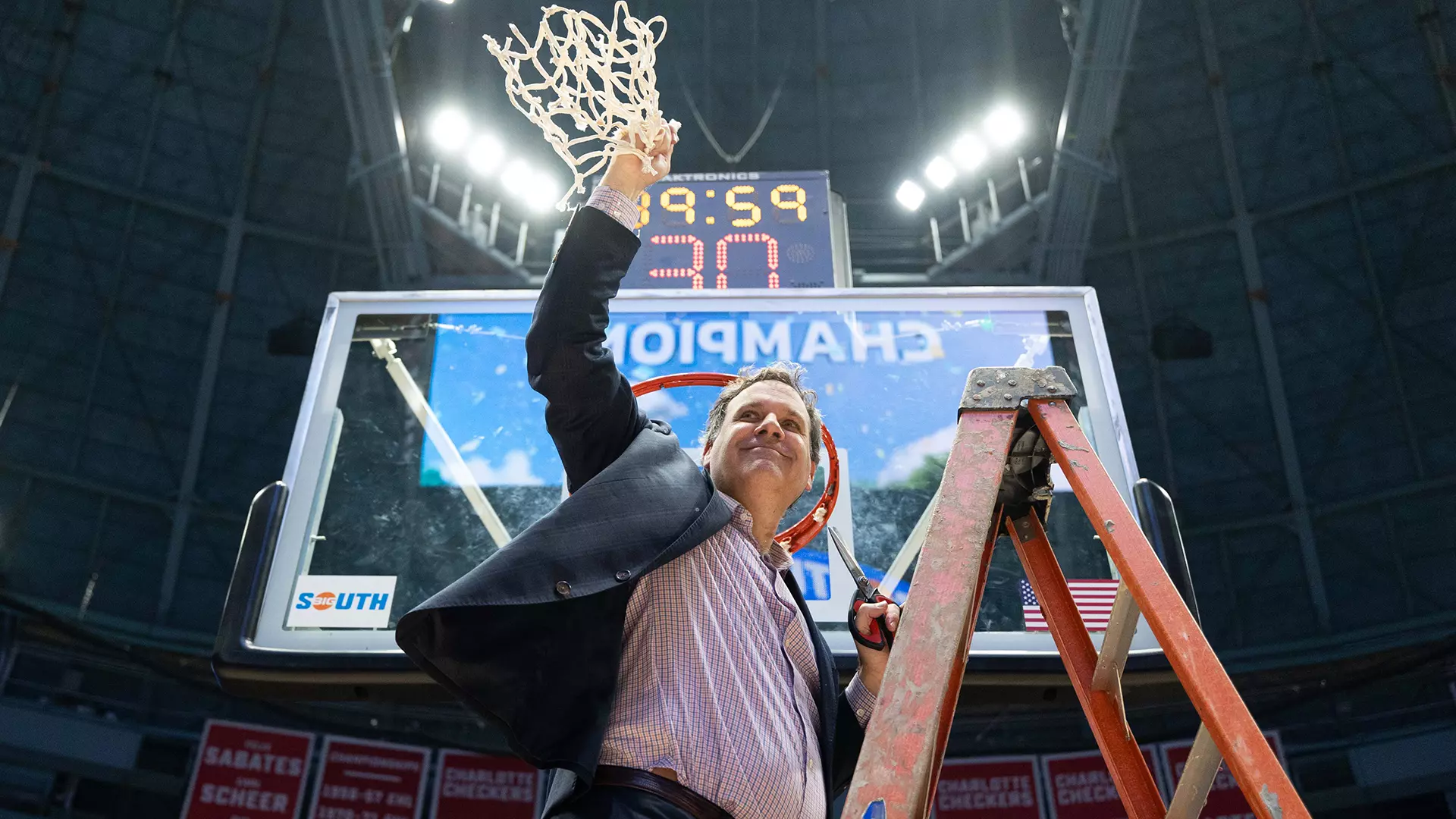 Longwood men’s basketball head coach Griff Aldrich cuts down the net 