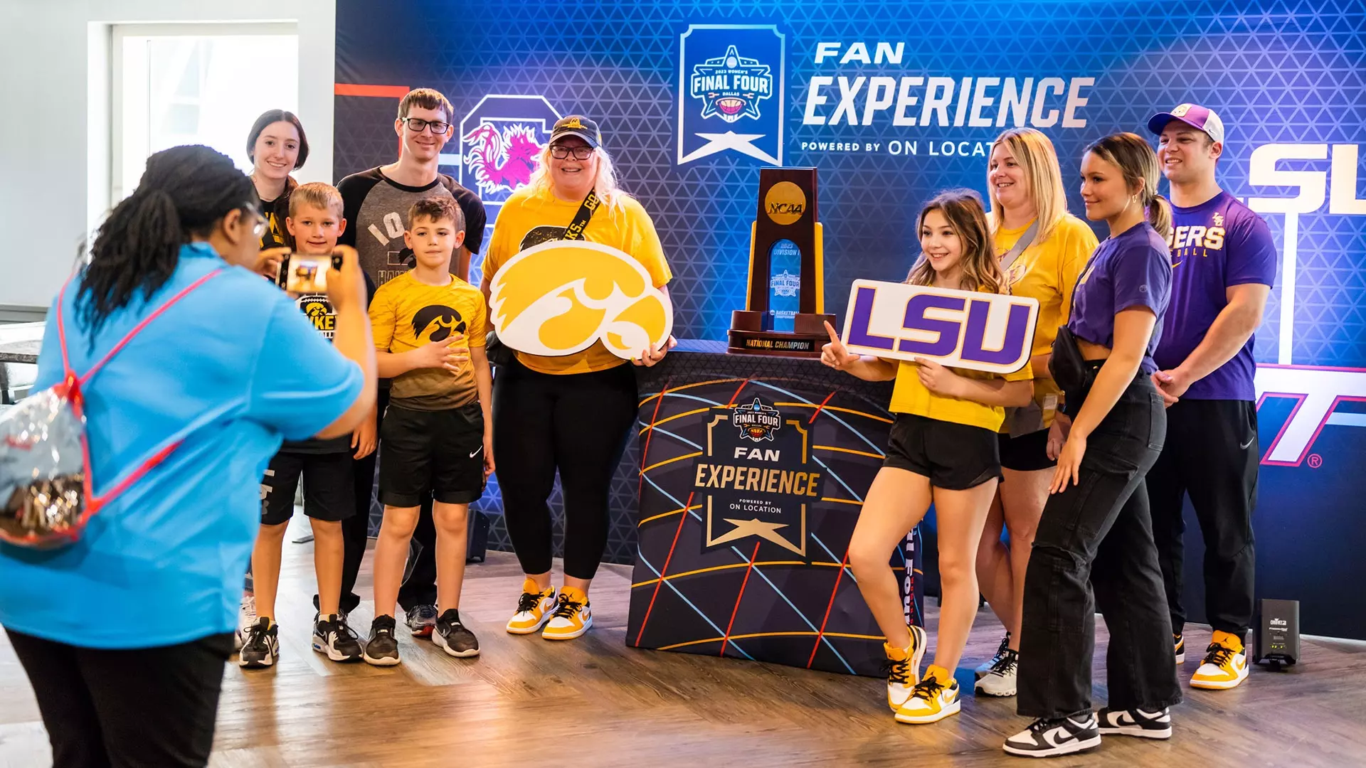 This is a photo of Iowa and LSU fans participating in an On Location Fan Experience at the 2023 NCAA Women's Final Four.