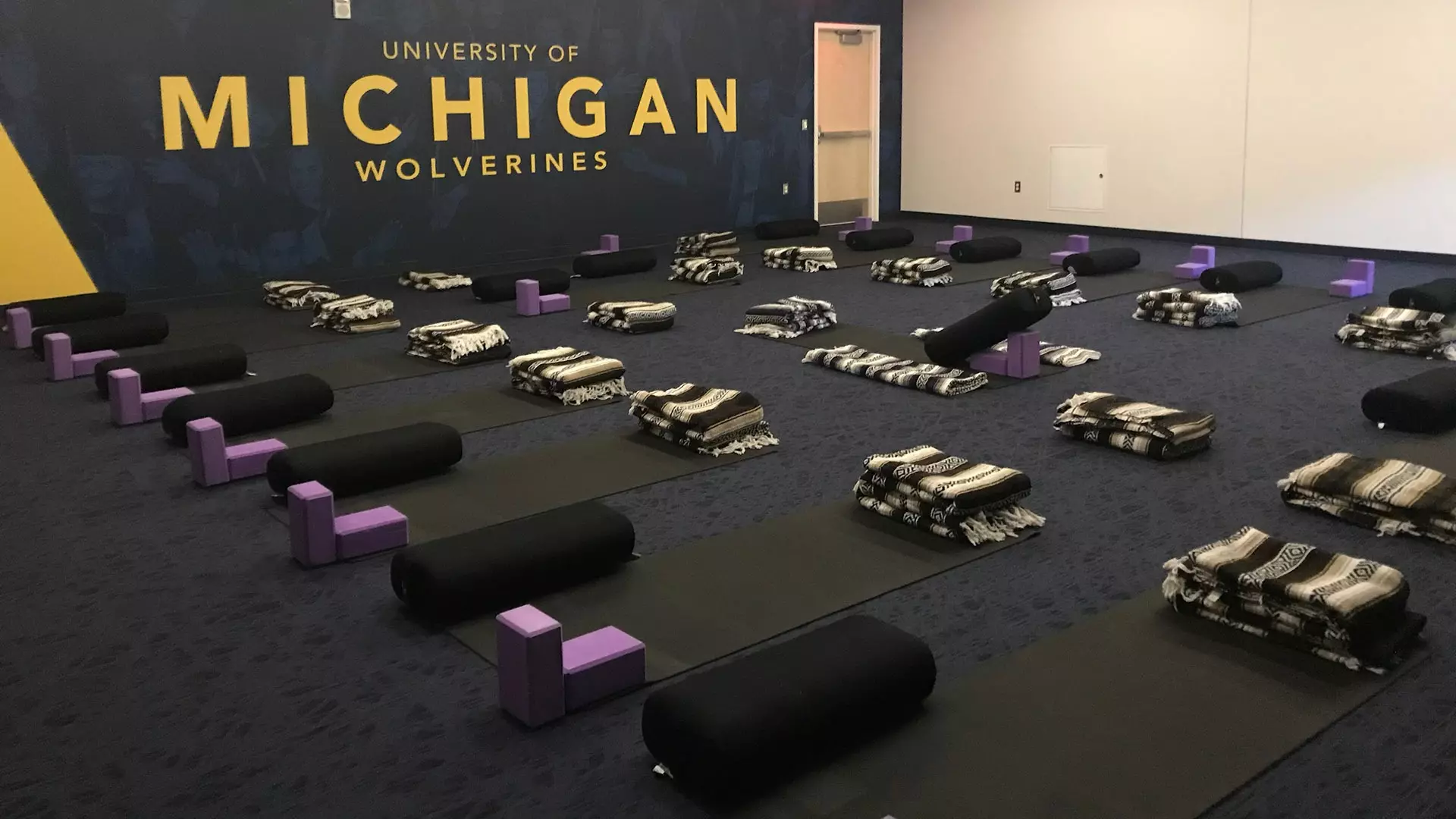 Michigan’s Athletes Connected program includes restorative yoga sessions for student-athletes. (Photos courtesy of Rachel Amity)