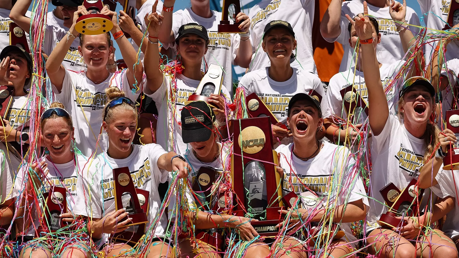 This picture shows the 2022 NCAA Division I women's rowing national champions celebrating.