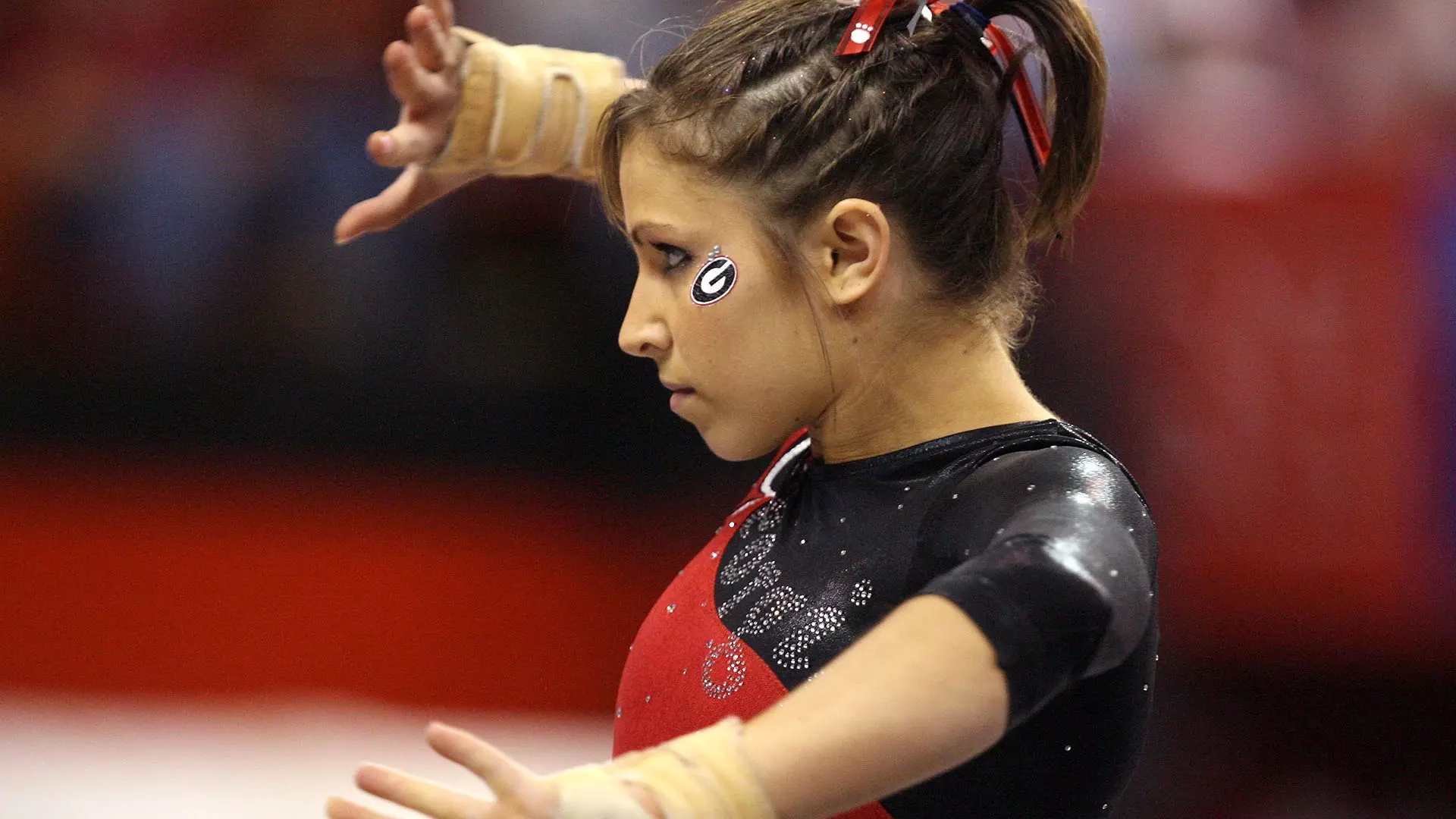 Courtney Kupets Carter competes in the floor exercises