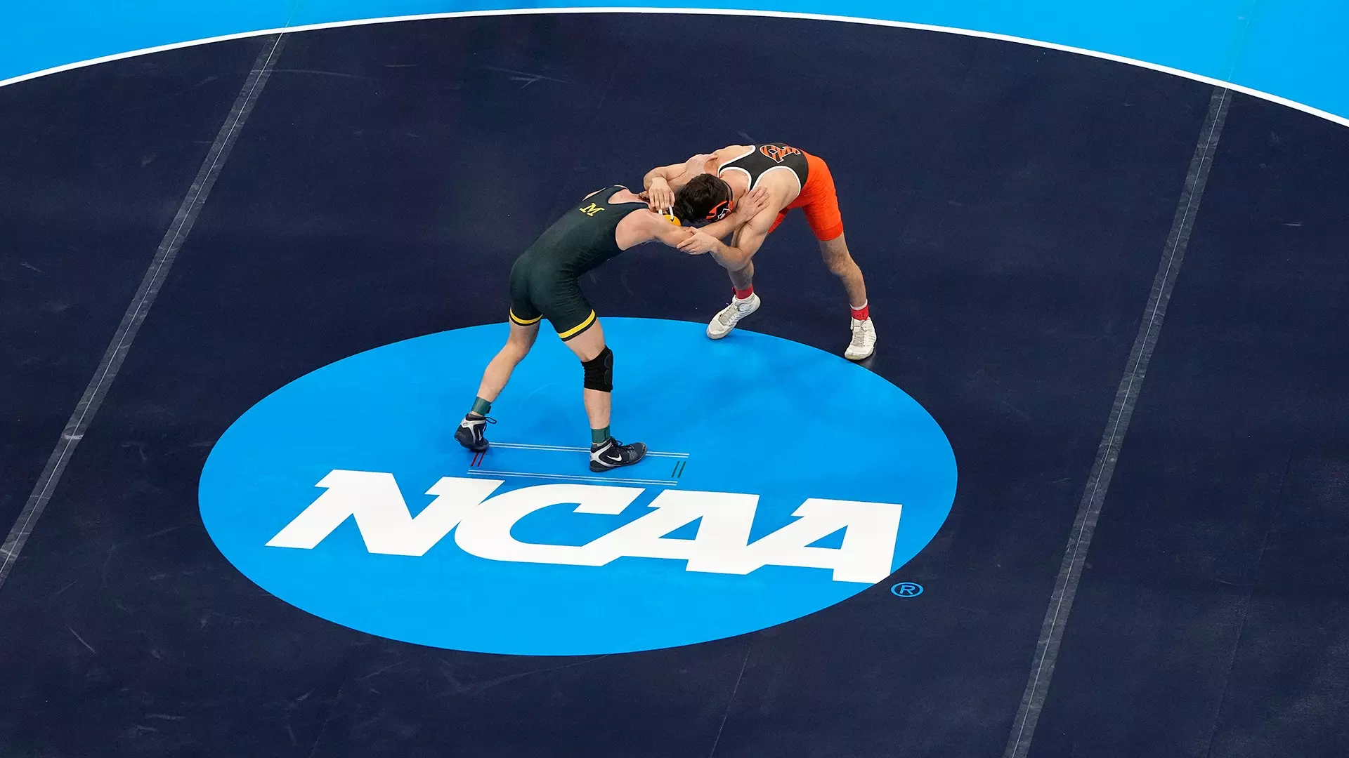 This is a picture of the NCAA blue disk on a wrestling mat.