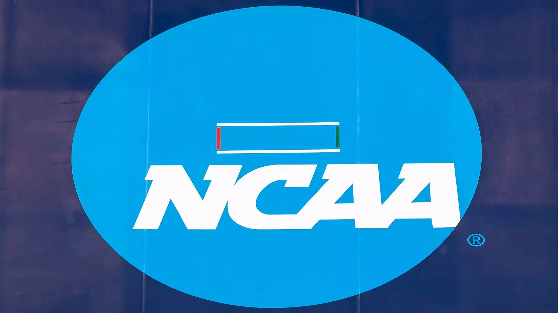This is a photo of the NCAA logo on the mat at the Division I Wrestling Championship.