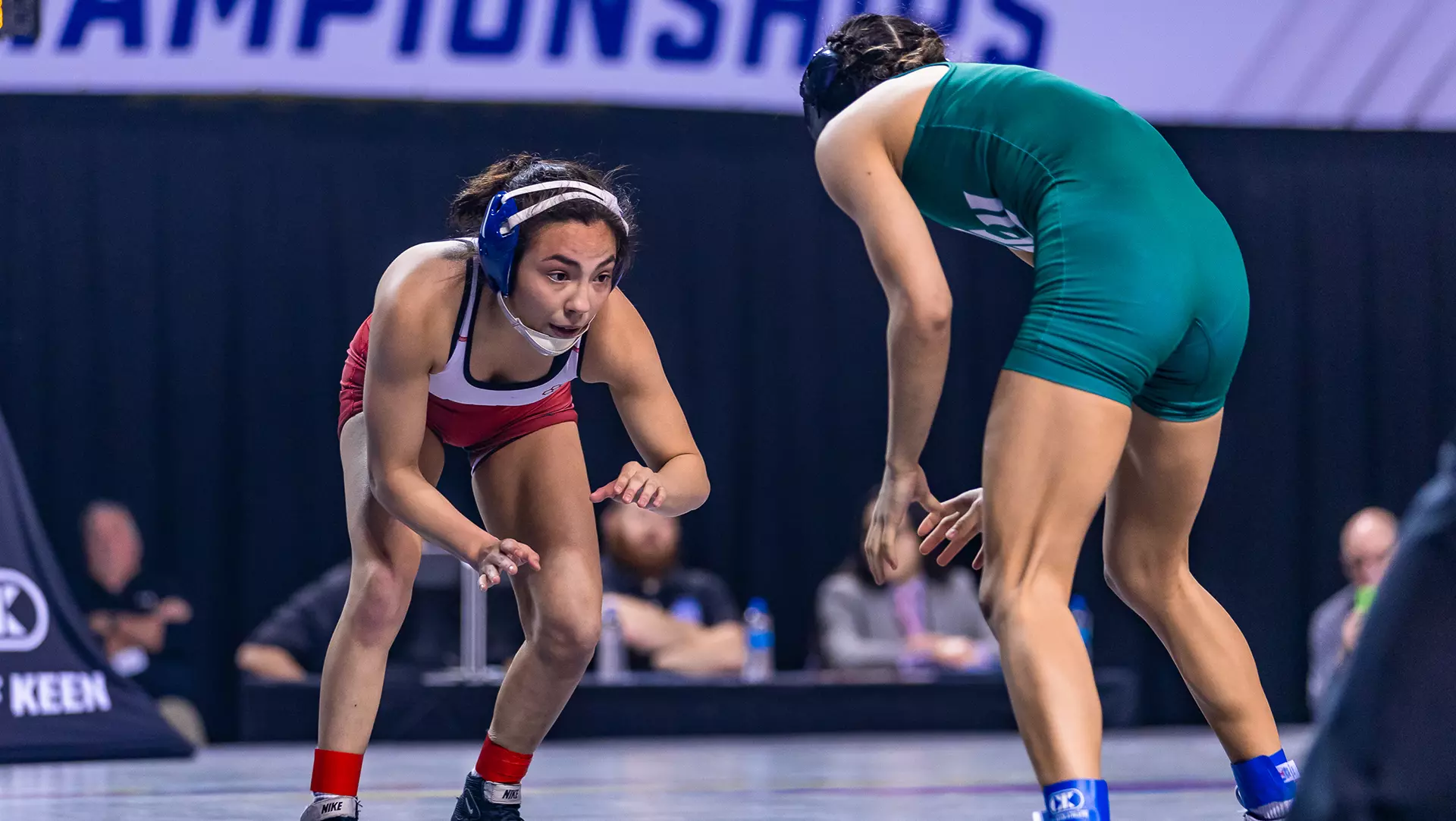 Maddie Avila, left, a women’s wrestler at North Central (Illinois), competes in a match during the 2022-23 season. (Photo courtesy of North Central (Illinois)) 