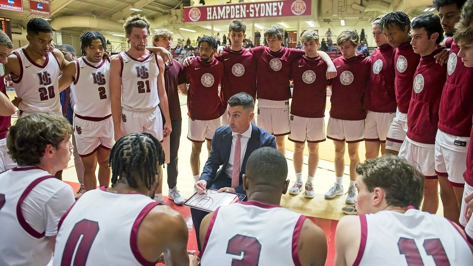 Hampden-Sydney men’s basketball head coach Caleb Kimbrough (middle)