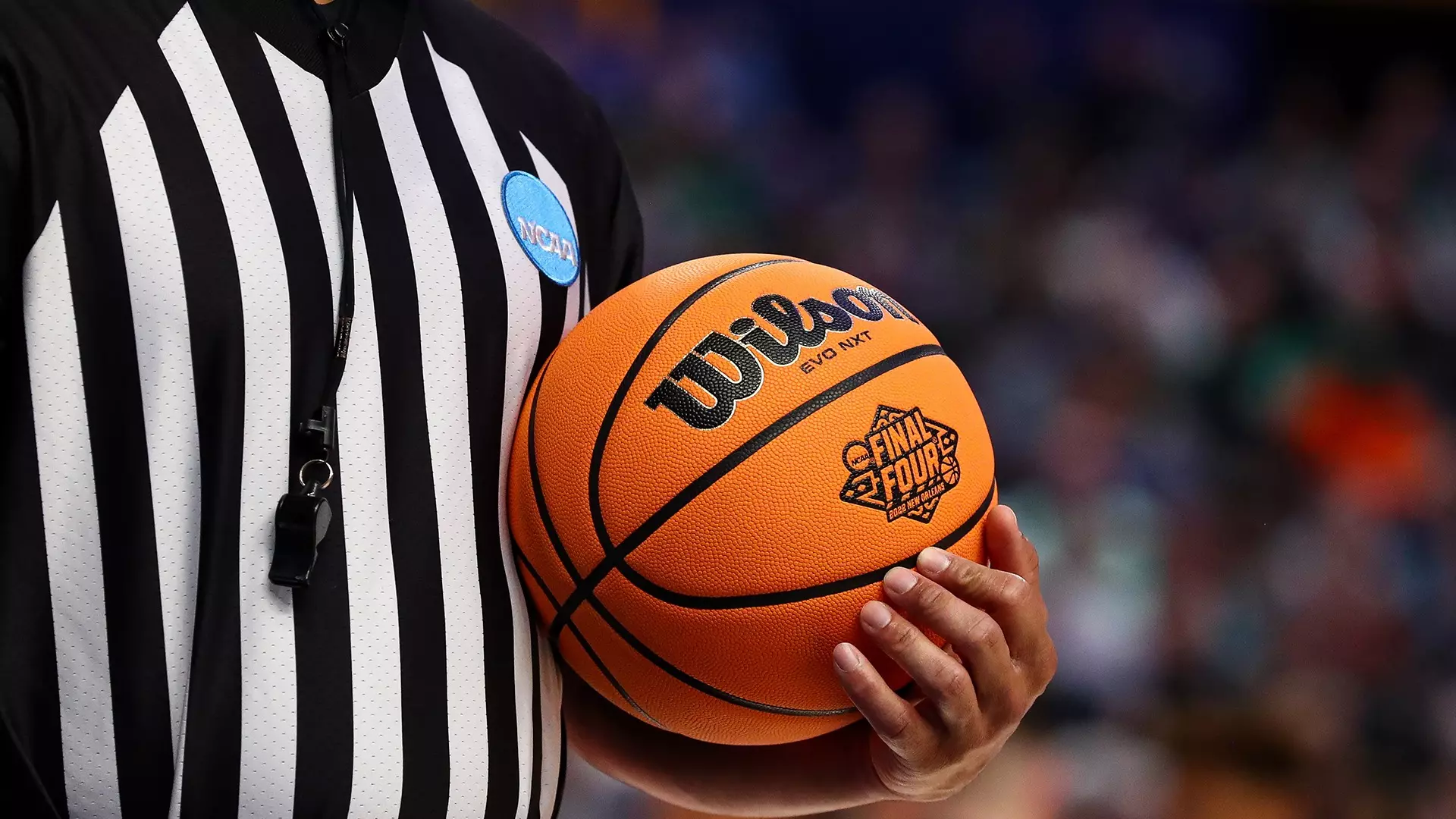D1 Men's Basketball Official Holding 2022 Final Four Basketball