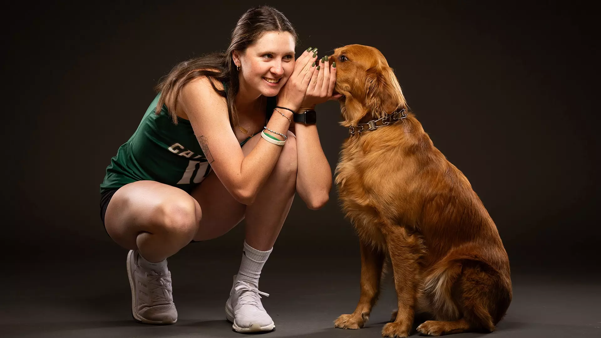 Cal Poly beach volleyball student-athlete Ella Connor has a service dog named Herc who is specifically trained for panic attacks.  
