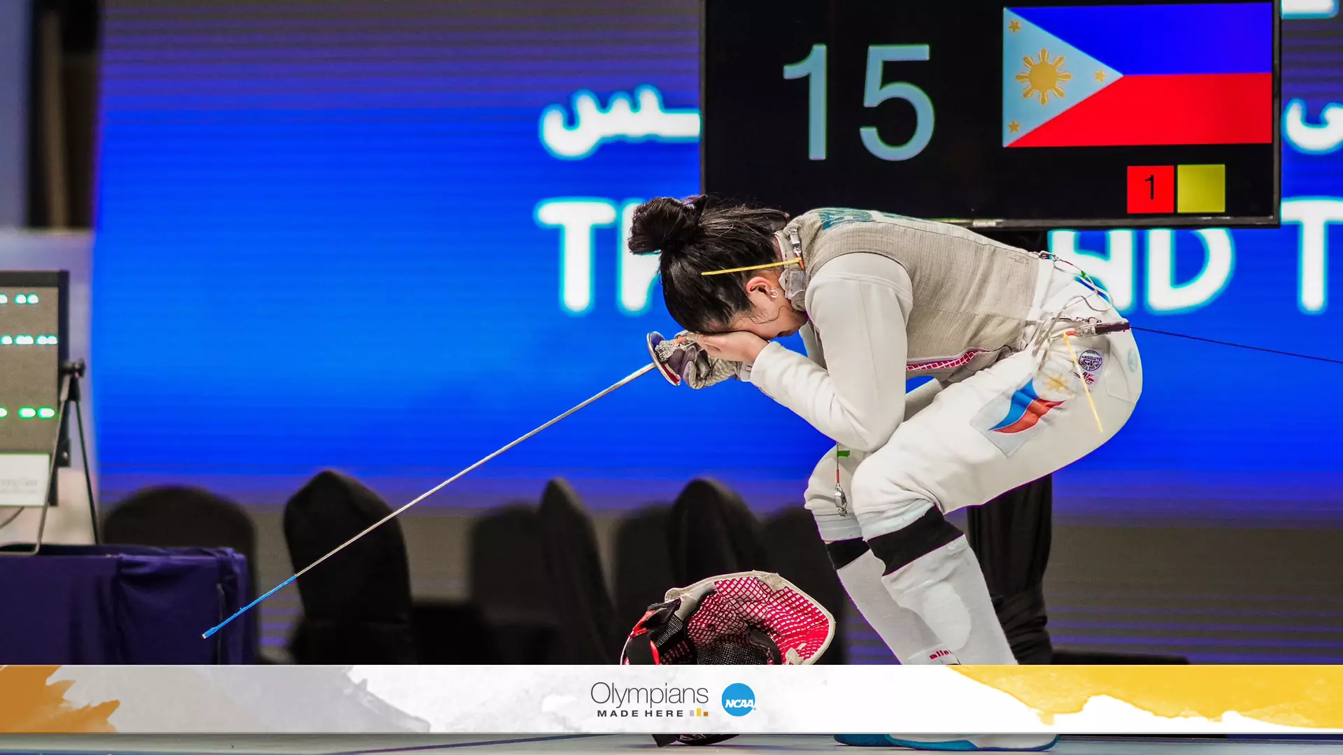 Samantha Catantan celebrates after qualifying for the Paris Olympics by winning the women’s individual foil event.