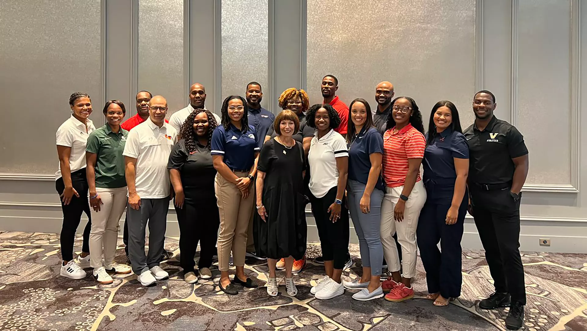 Administrators selected to the NCAA’s Dr. Charles Whitcomb Leadership Institute in 2023 stand together at last year’s initial programming event. 