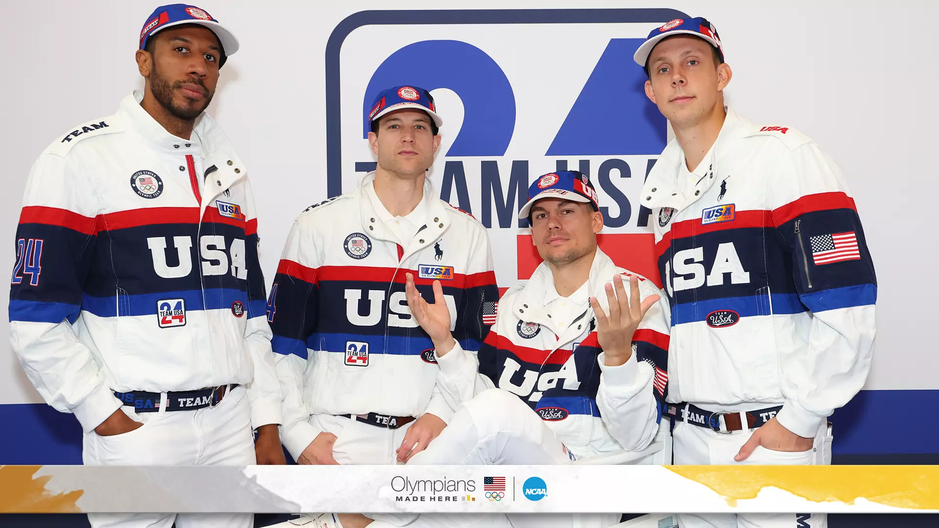 PARIS, FRANCE - JULY 23: Kareem Maddox, Jimmer Fredette, Dylan Travis and Canyon Barry try on clothes at the Team USA Welcome Experience Ahead of Paris 2024 on July 23, 2024 in Paris, France. (Photo by Joe Scarnici/Getty Images for USOPC)