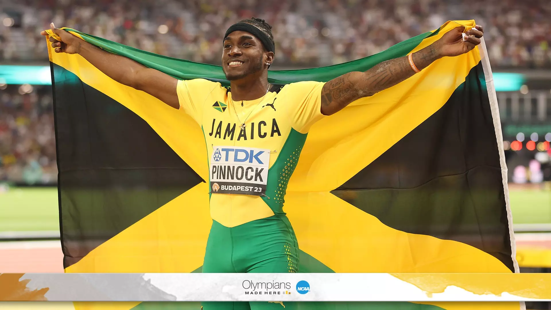 Wayne Pinnock credits his daughter, family and Arkansas coach for his successful career in the long jump. 