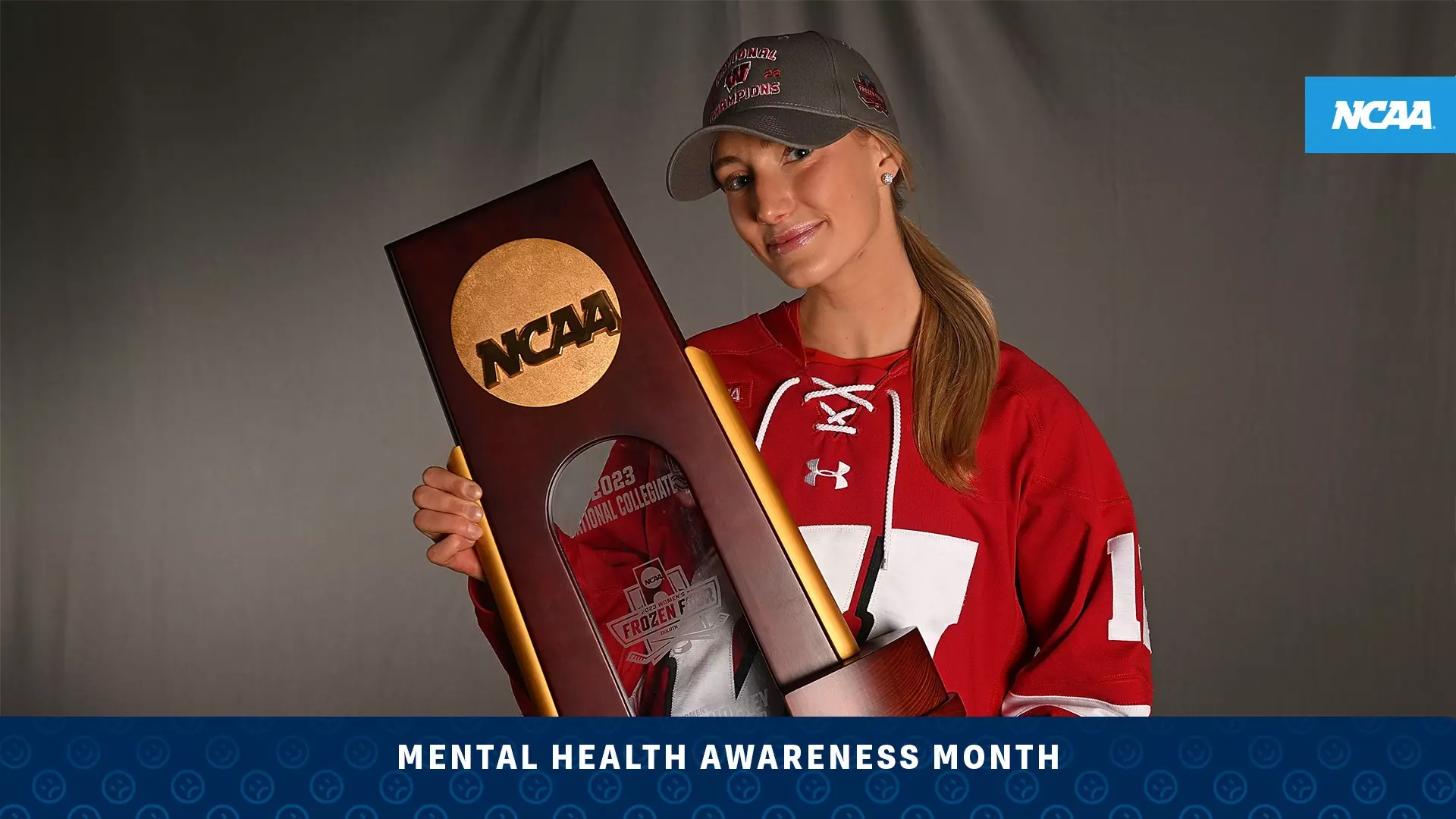 Grace Shirley holds the National Collegiate Women’s Ice Hockey Championship trophy — one of two titles she captured alongside her sister, Sophie, at Wisconsin. (Photo by Justin Berl / NCAA Photos)