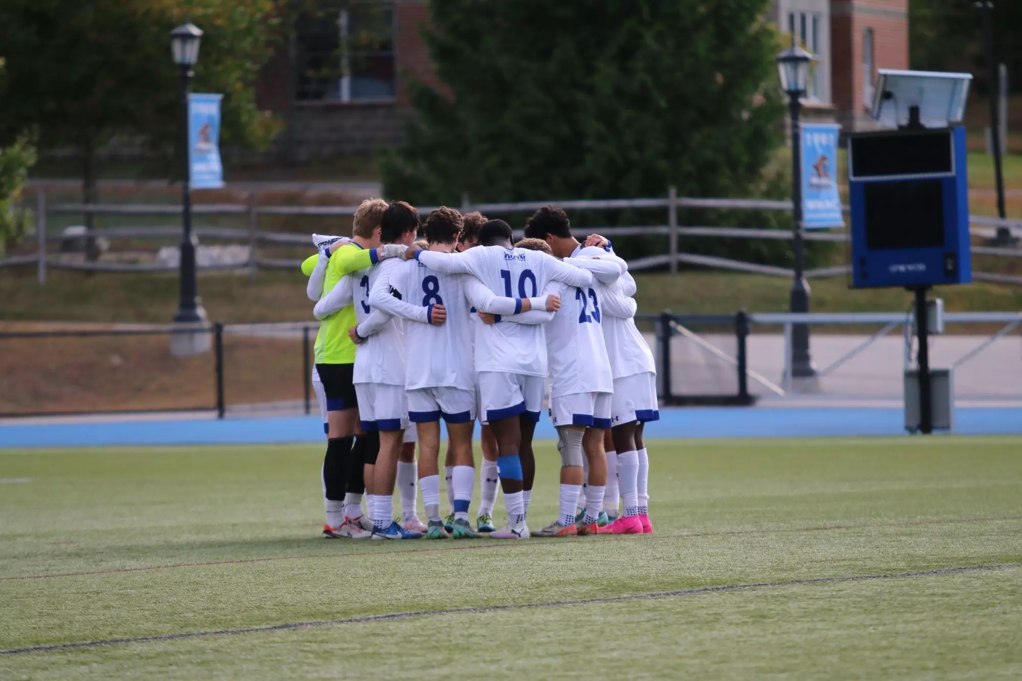 men's soccer team huddle 