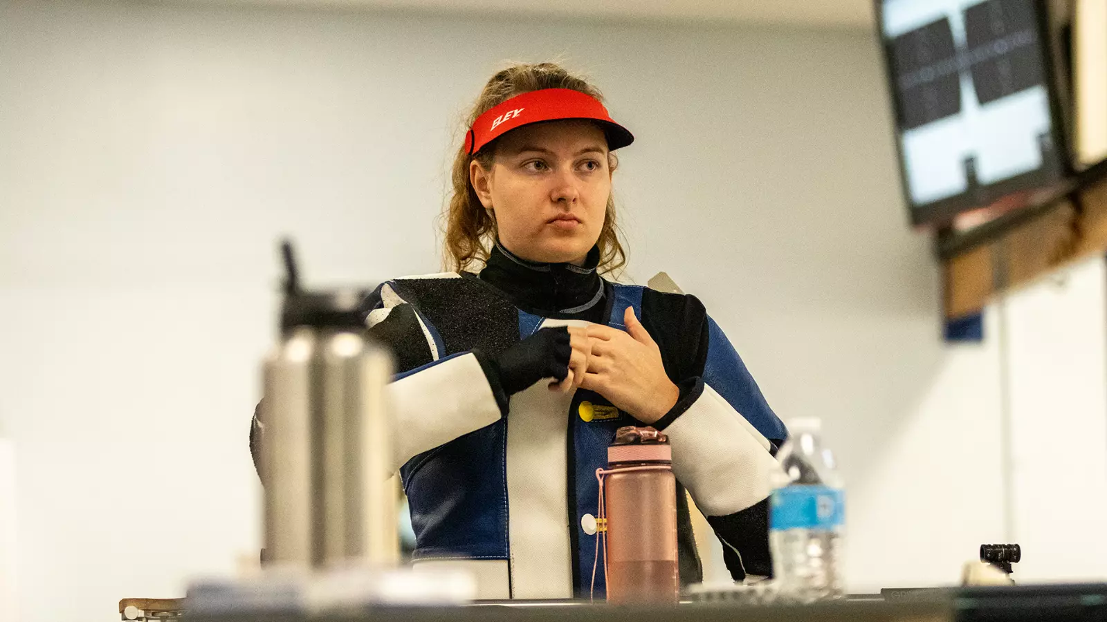 Sara Karasova settles at the tables in the E.F. Horton Rifle Range during a match in 2022-23