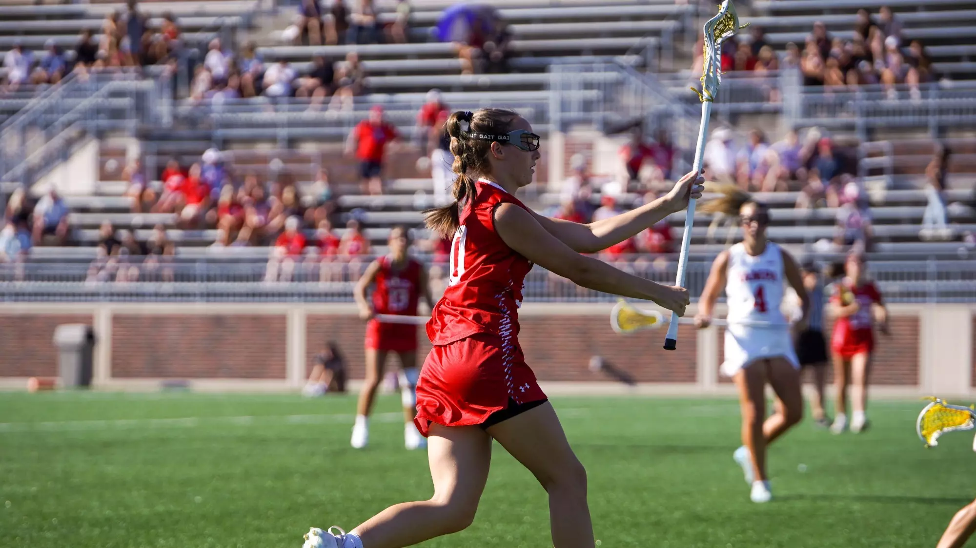 Hannah Hale passing in red jersey